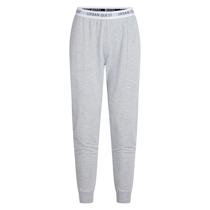 Graue Jogginghose mit elastischem Bund und dem Text "Urban Quest".