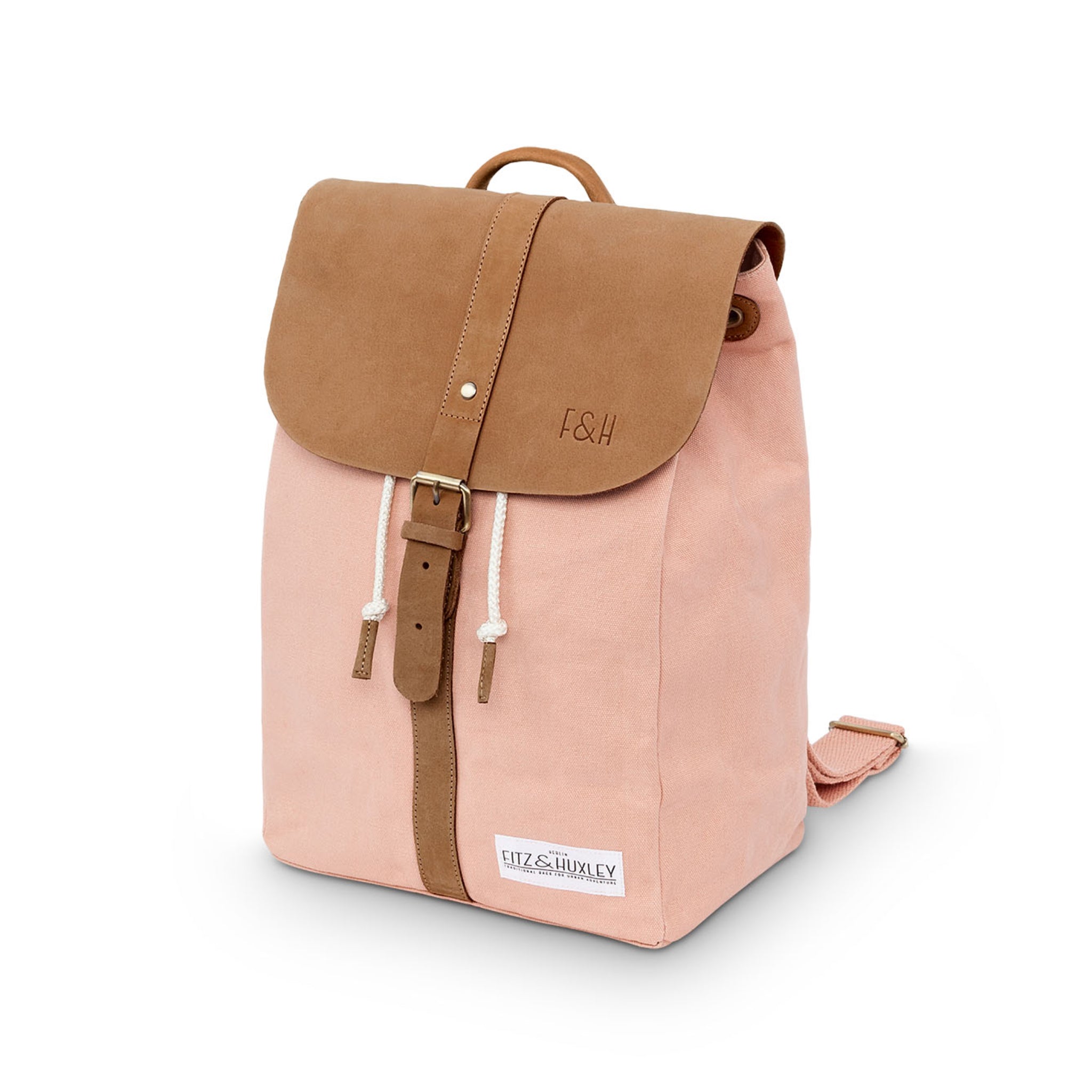 Rosa Rucksack mit braunem Überschlag und Riemen, verziert mit „F&H“, seitlichem Logoetikett und Kordelzug.