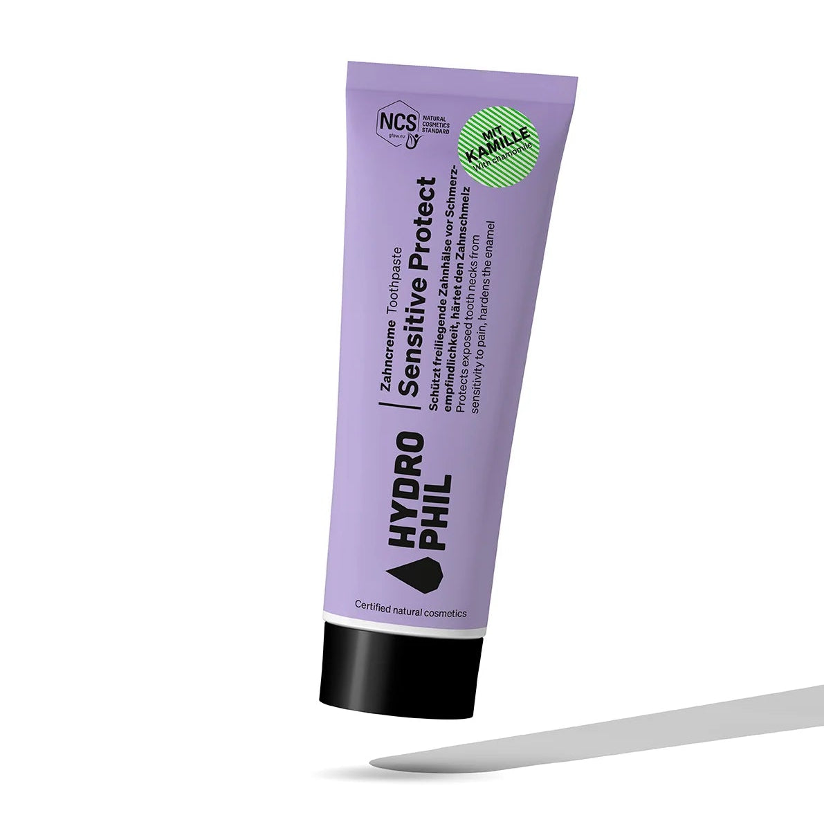 Eine violette Tube HYDROPHIL Sensitive Protect Zahnpasta mit schwarzer Kappe und Öko-Zertifizierungssiegeln steht aufrecht auf einem weißen Hintergrund mit einem grauen Schatten darunter.