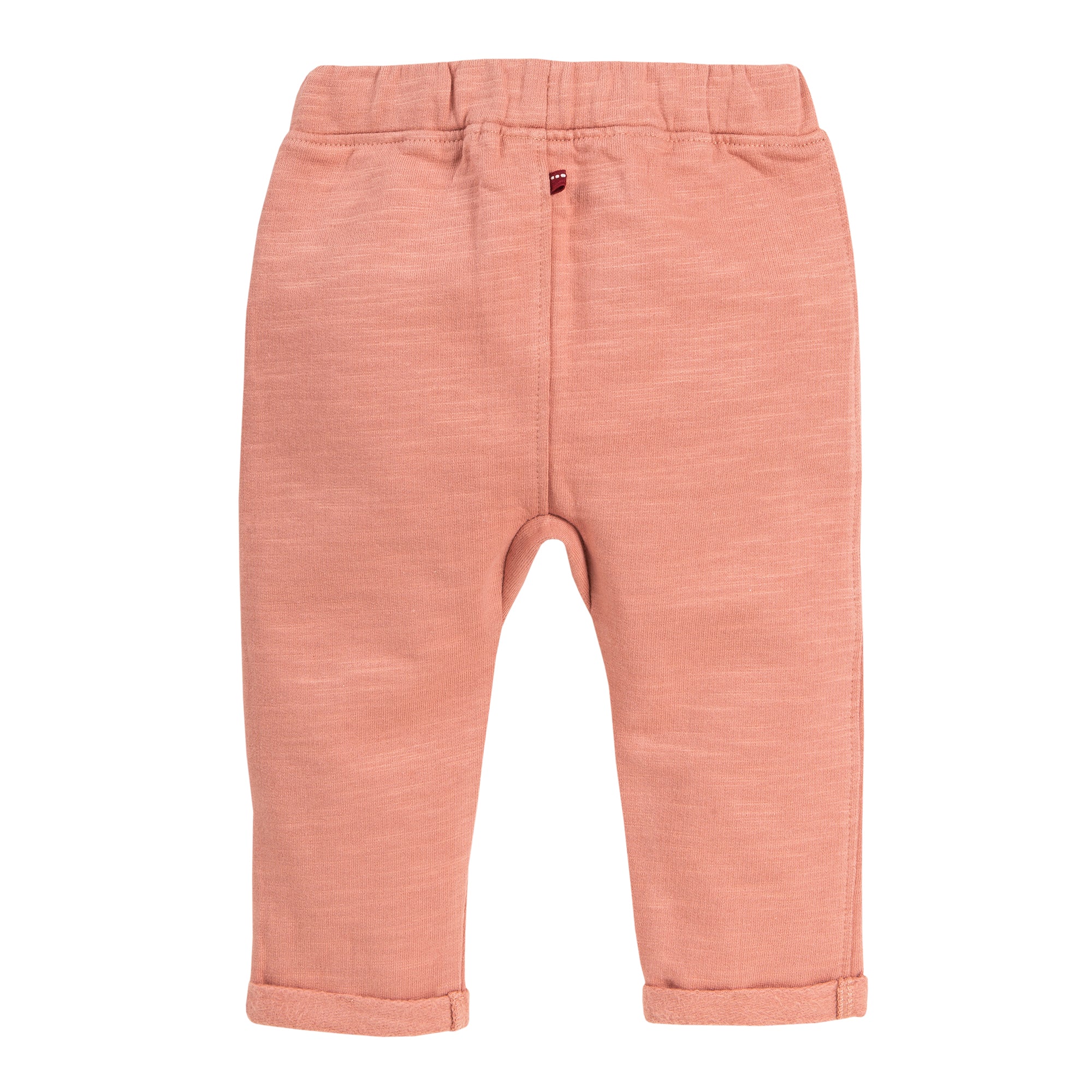 Hellrosa Babyhose mit elastischem Bund und aufgerollten Bündchen, flach auf weißem Hintergrund dargestellt.
