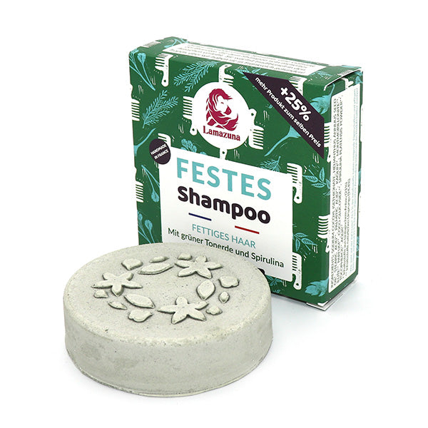 Feste Shampoobar mit Blumenmotiven und einer Verpackung mit grünen Blattmustern für fettiges Haar.