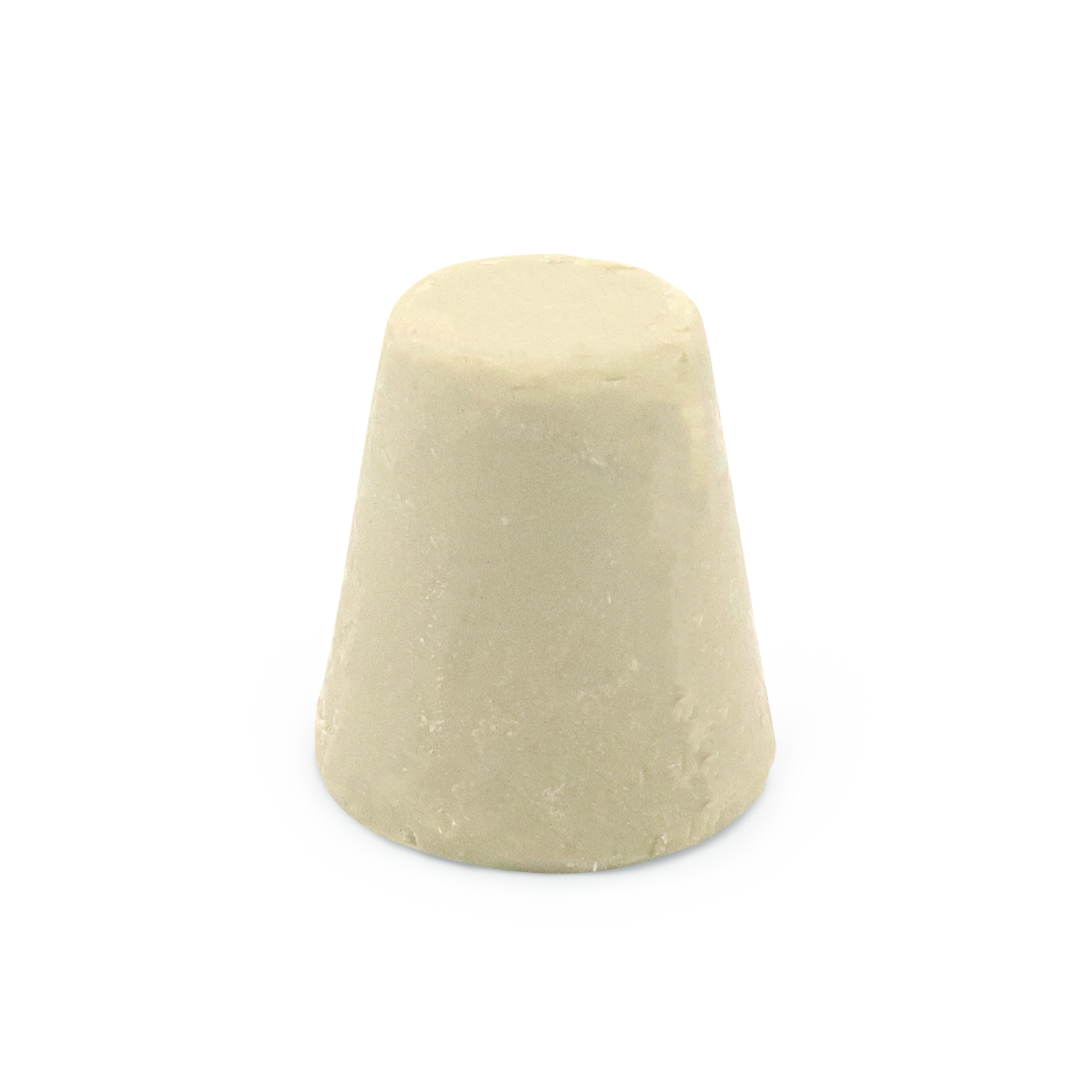Ein cremefarbener Zuckerhut in konischer Form auf hellem Hintergrund.