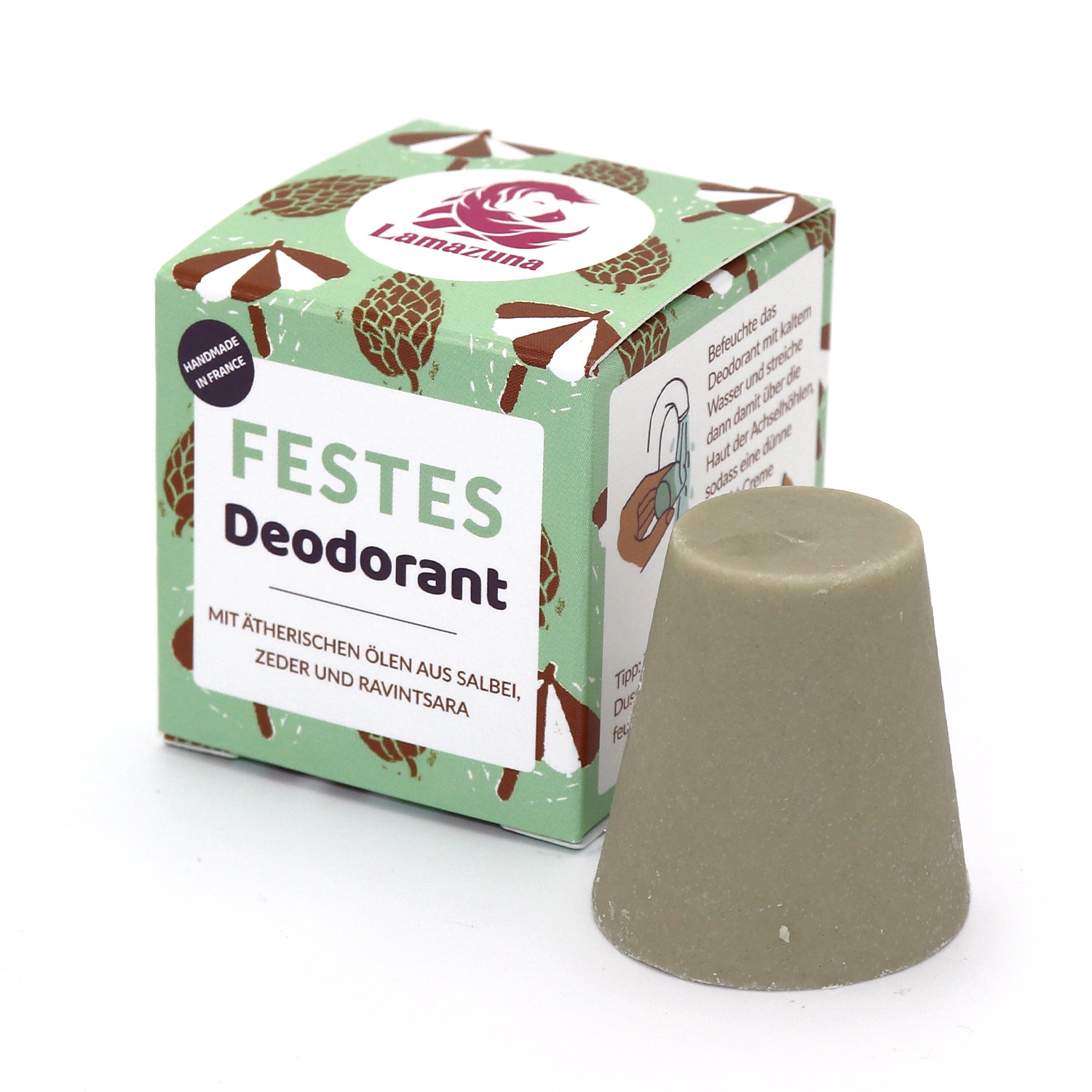 Festes Deodorant von Lamazuna, verpackt in einer grünen Box mit Kiefernzapfenmuster, daneben der Deostick.