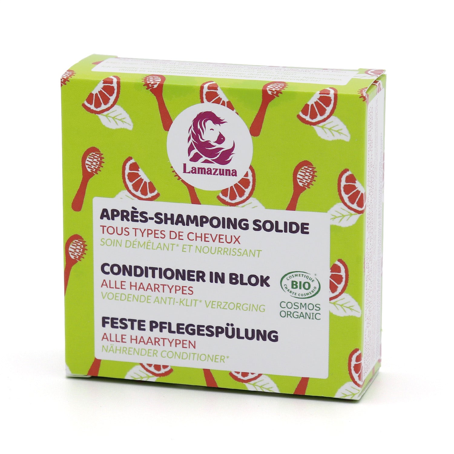 Grüne Verpackung eines festen Conditioners von Lamazuna, dekoriert mit roten Bürsten und Segmenten, für alle Haartypen.
