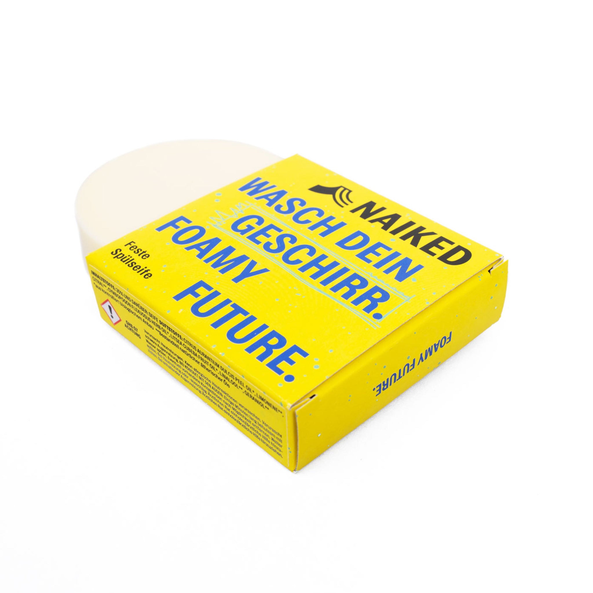 Gelbe Verpackung fester Spülseife mit der Aufschrift "Wasch dein Geschirr. Foamy Future." und einem Stück Seife.