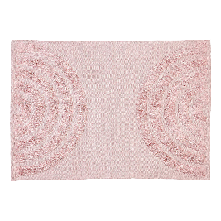 Rosa Badematte mit symmetrischen, halbrunden Mustern auf beiden Seiten.