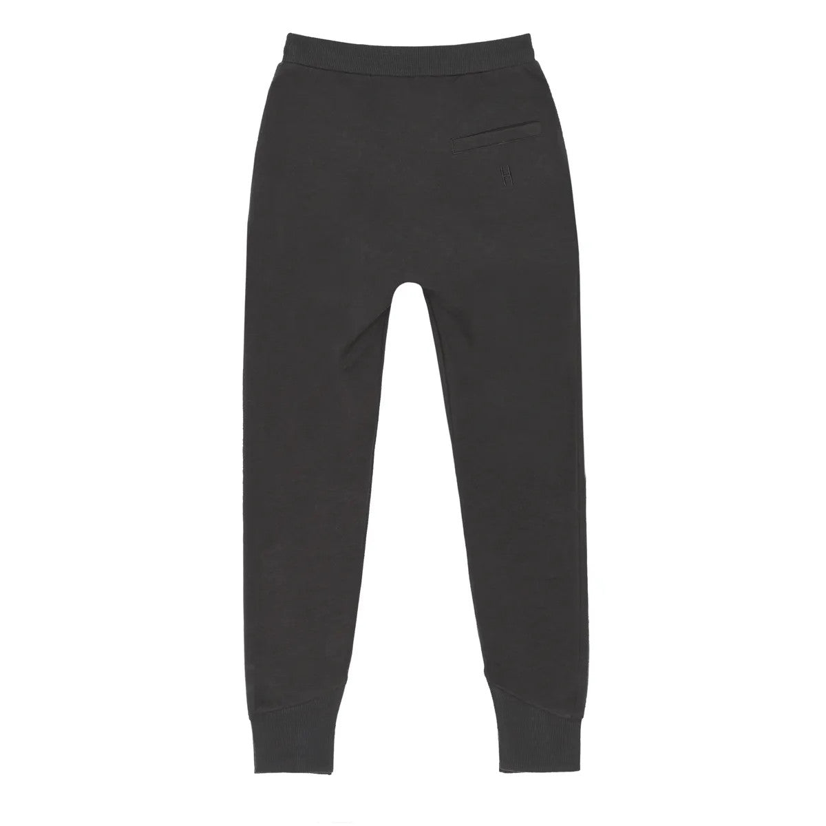 Schwarze Jogginghose mit elastischem Bund, gerippten Bündchen an den Knöcheln und einer einzigen Reißverschlusstasche auf der Rückseite. Die Hose liegt flach auf einem weißen Hintergrund.
