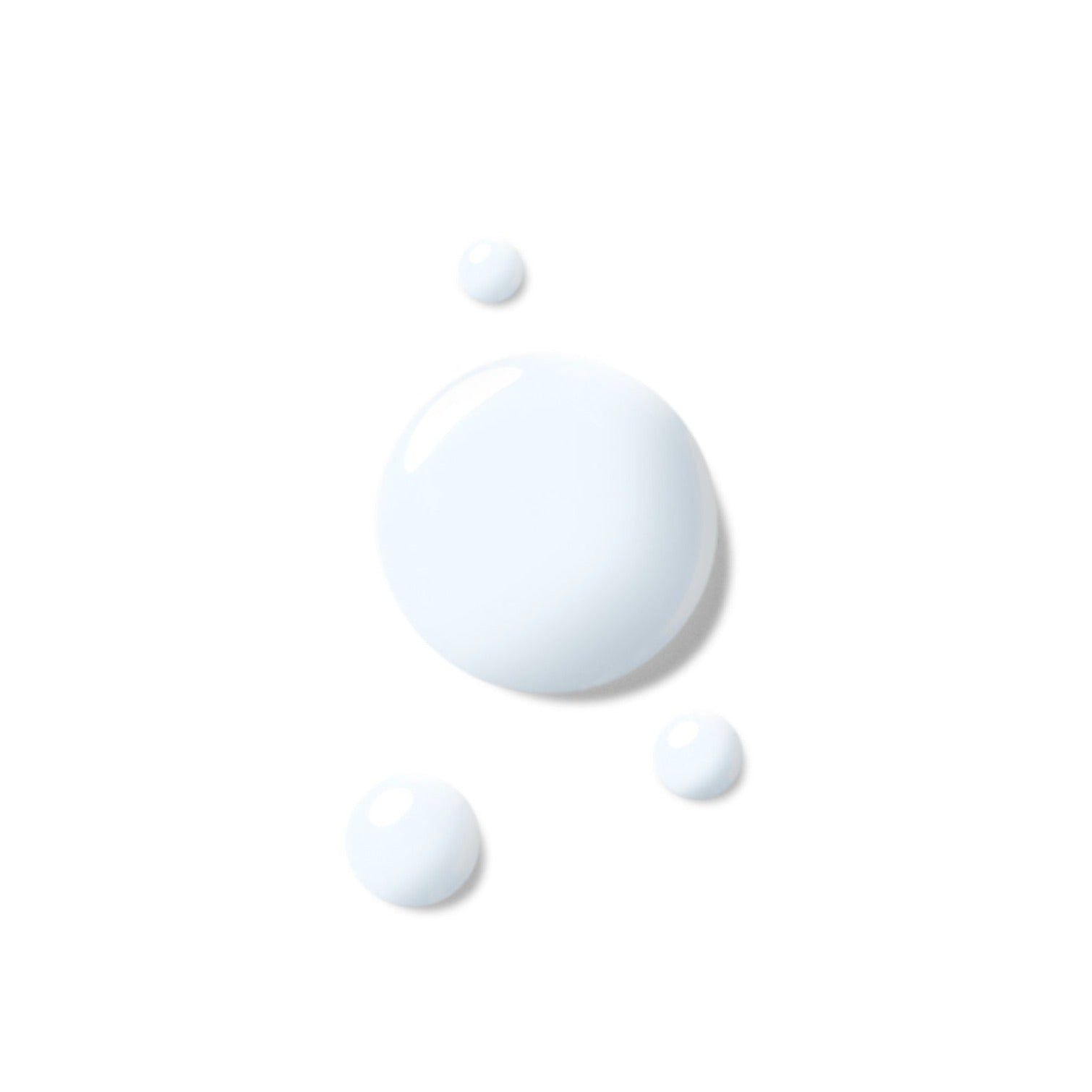 Weiße Flüssigkeitstropfen unterschiedlicher Größe auf weißem Hintergrund.