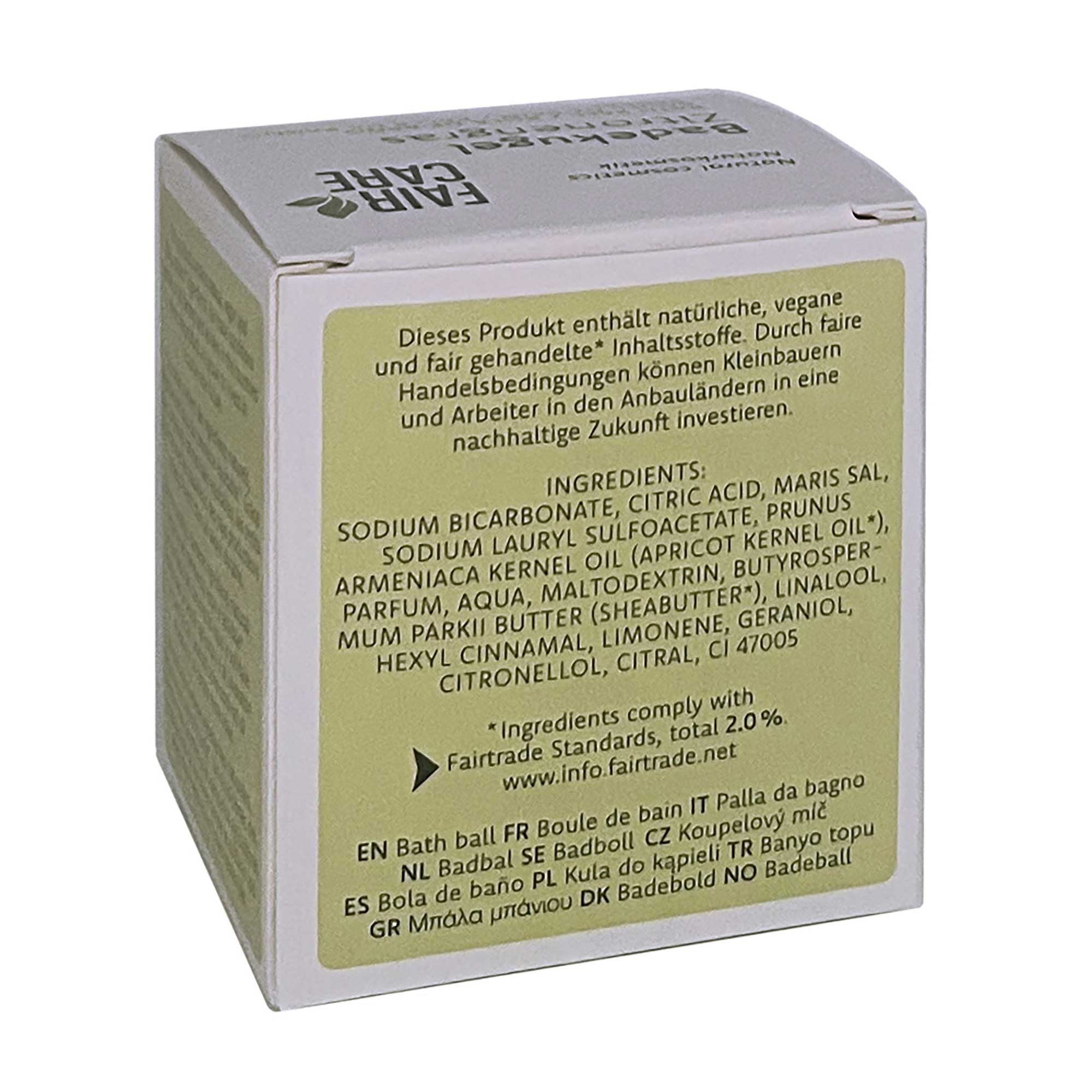 Auf der Rückseite befindet sich eine rechteckige Schachtel mit deutschem Text, in dem die Zutaten des Produkts und die Einhaltung der Fairtrade-Standards aufgeführt sind. Die Schachtel ist hellgrün und beige mit schwarzem und grünem Aufdruck.