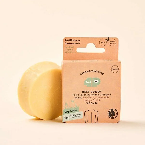 Verpackung und runde Scheibe einer veganen, festen Körperbutter mit Orange und Minze, zertifizierte Biokosmetik.