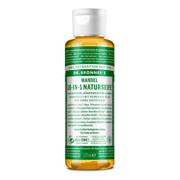Flasche der Dr. Bronner's Mandel 18-in-1 Naturseife mit grünem Etikett und Text in verschiedenen Sprachen.