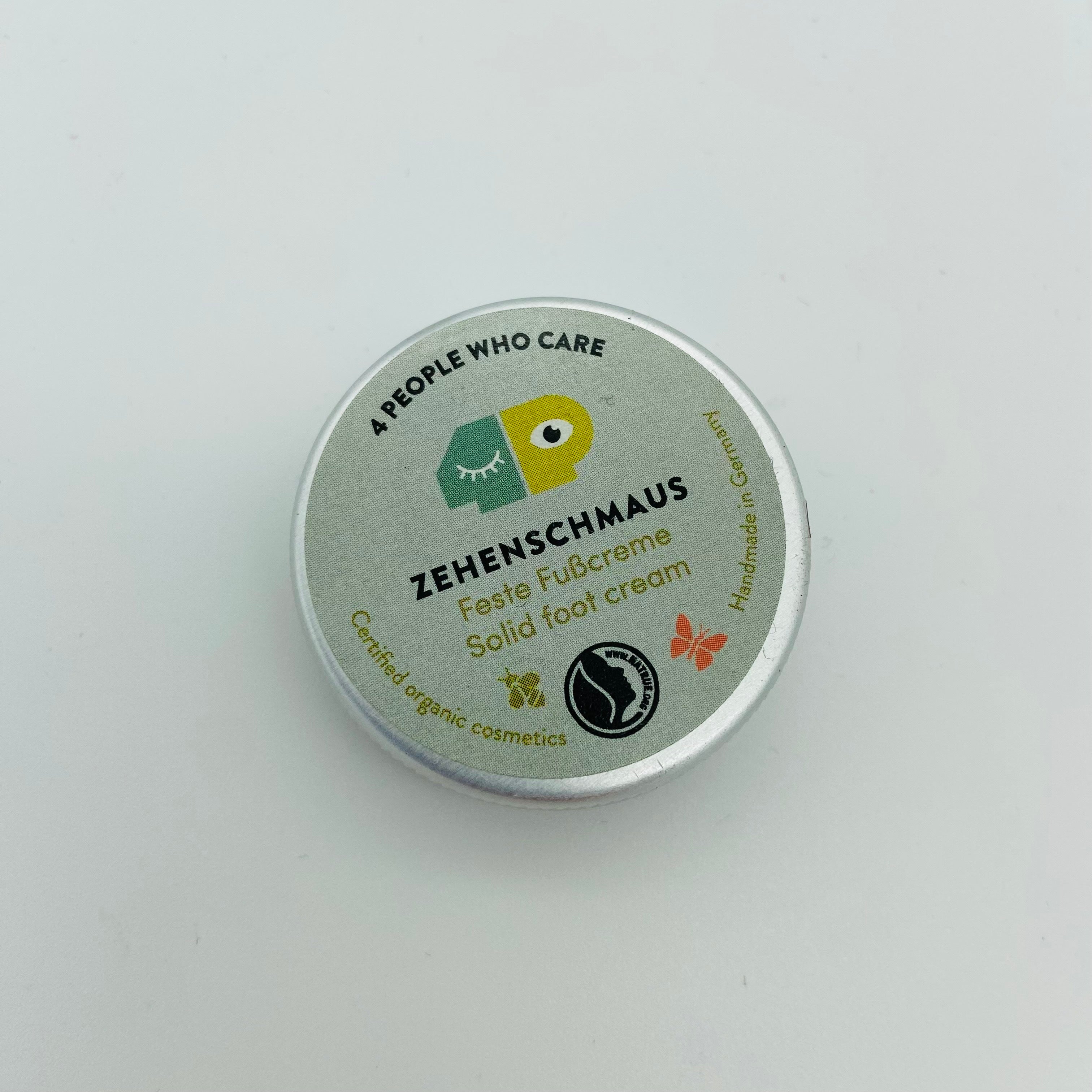 Runde Metalldose mit der Aufschrift "Zehenschmaus, Feste Fußcreme, Solid Foot Cream", Zertifiziert und handgefertigt.