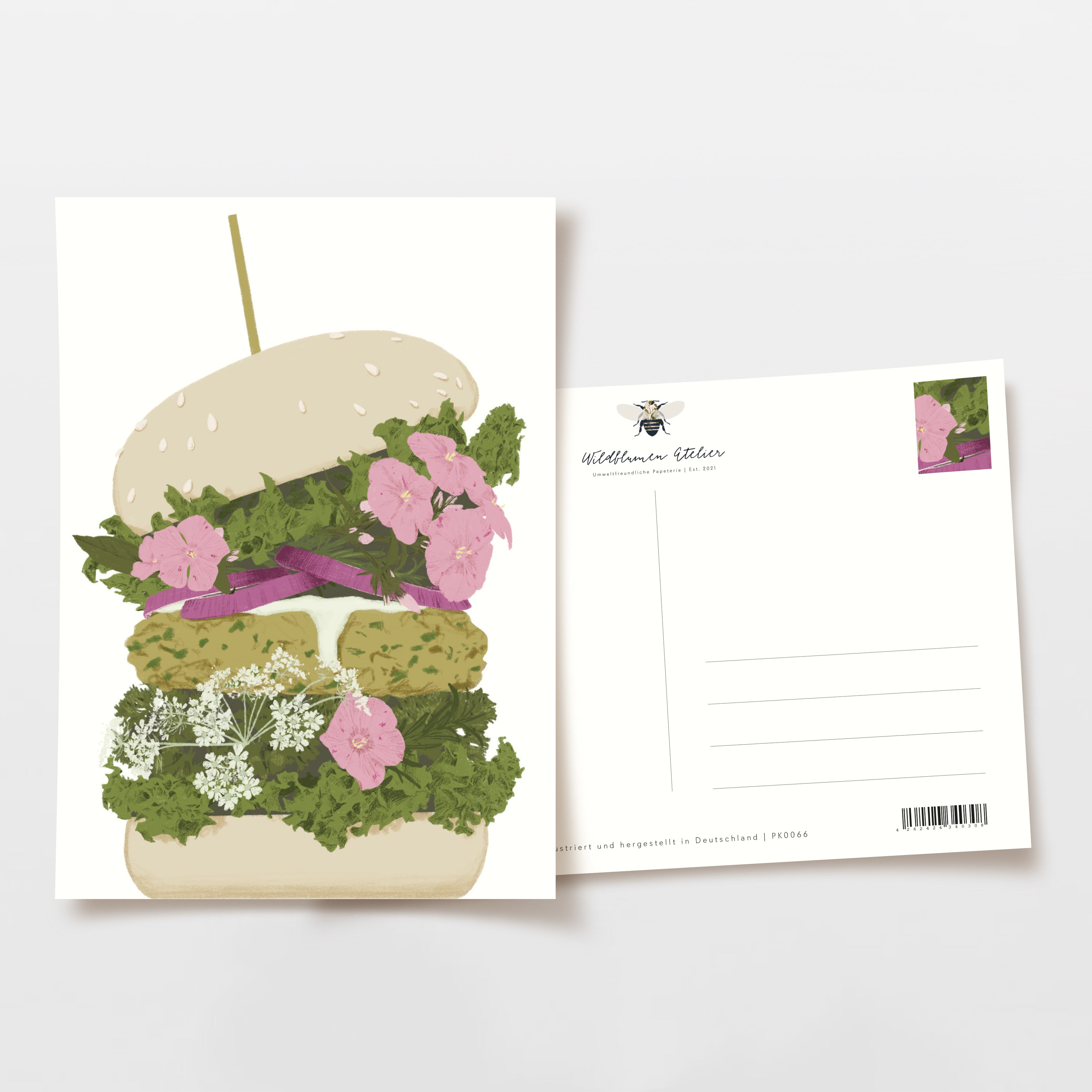 Postkarte mit einem kunstvollen Blumenburger-Motiv, bestehend aus Blüten und Blättern zwischen zwei Brötchenhälften.