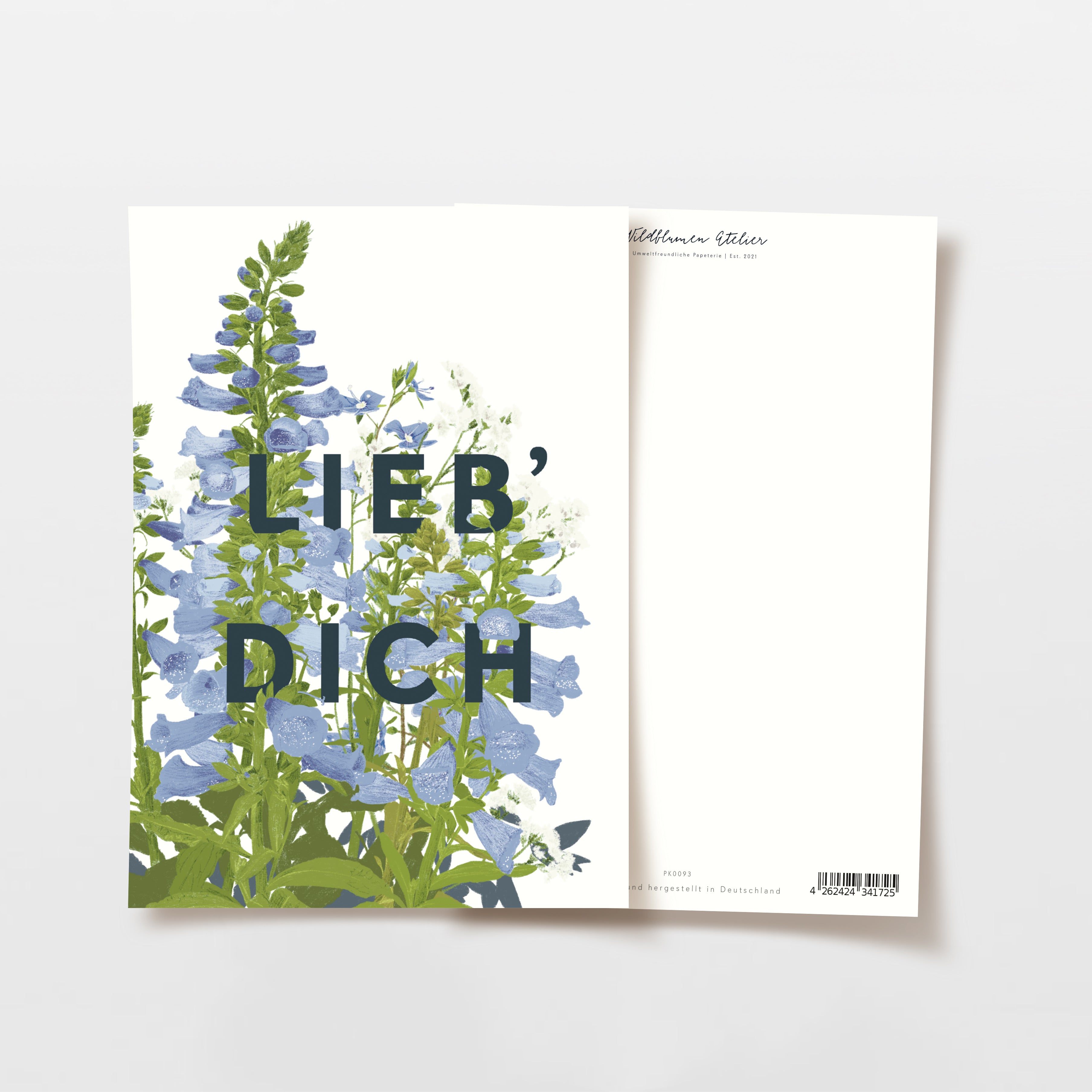 Karte mit blauen und grünen Blumen und dem Text "LIEB' DICH" darauf.