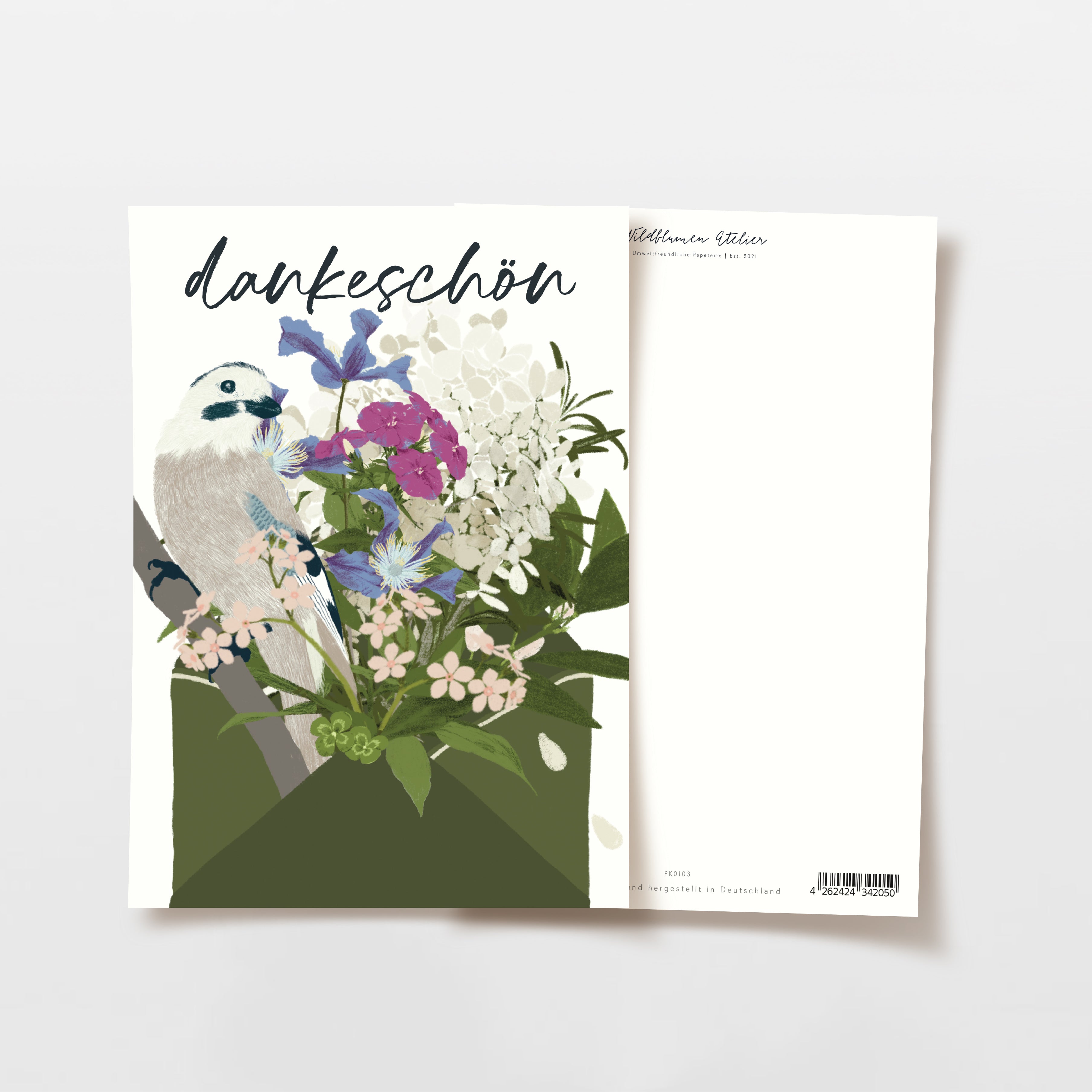 Eine Karte mit dem Wort "Dankeschön" am oberen Rand, mit einem illustrierten Vogel und einem bunten Blumenstrauß auf der Vorderseite, die eine einfache Karte mit Text auf der Rückseite teilweise überlappt.