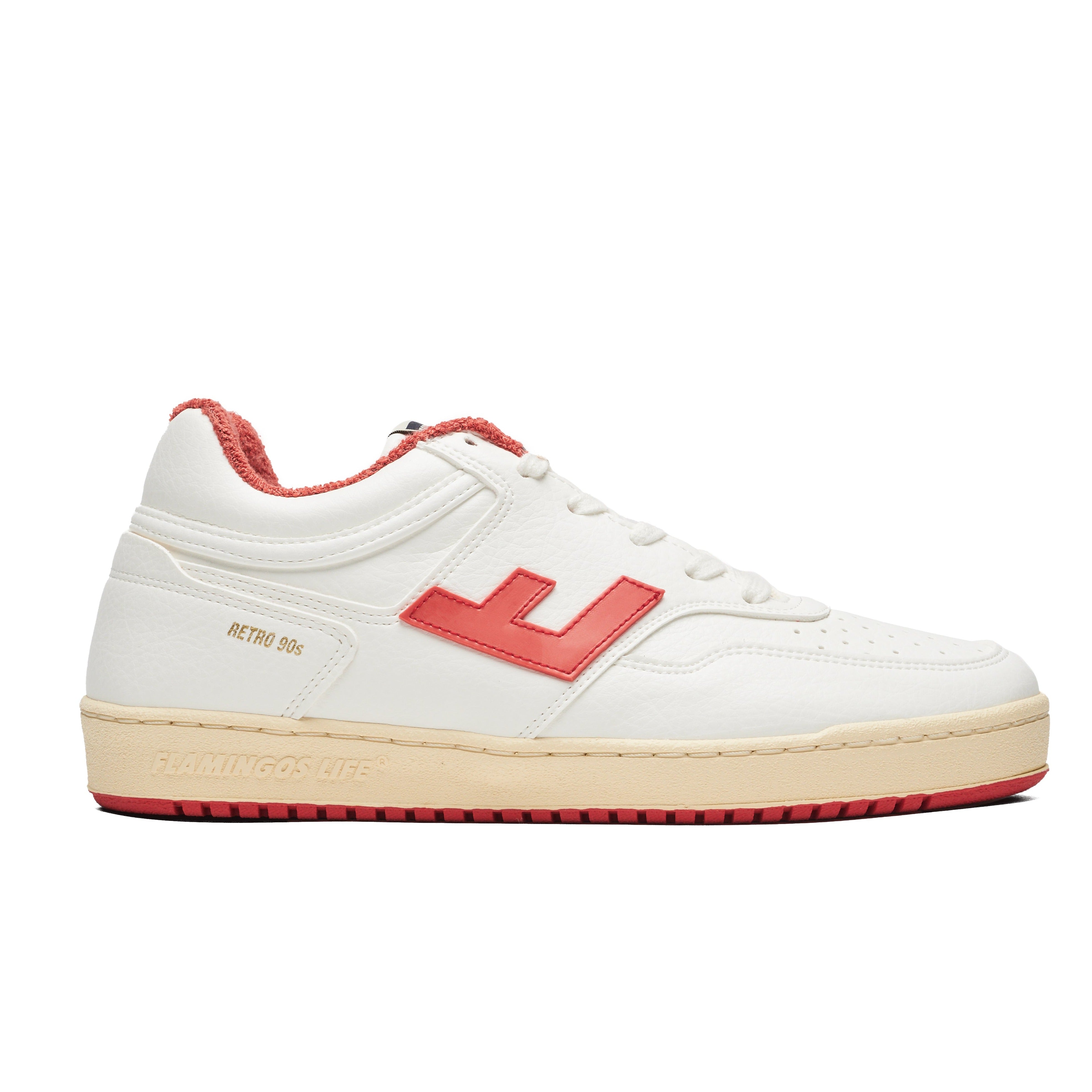 Weiße Sneaker mit rotem Logo und Sohle im Stil der 90er Jahre.