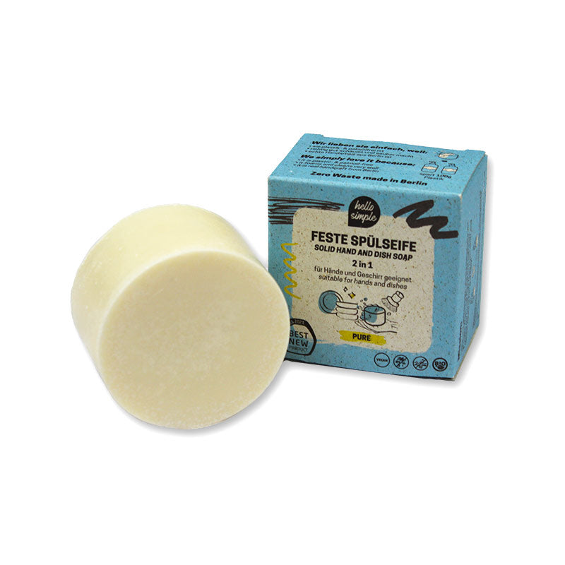 Feste Spülseife neben einer blauen Verpackung mit der Aufschrift "Feste Spülseife - Solid Hand and Dish Soap".