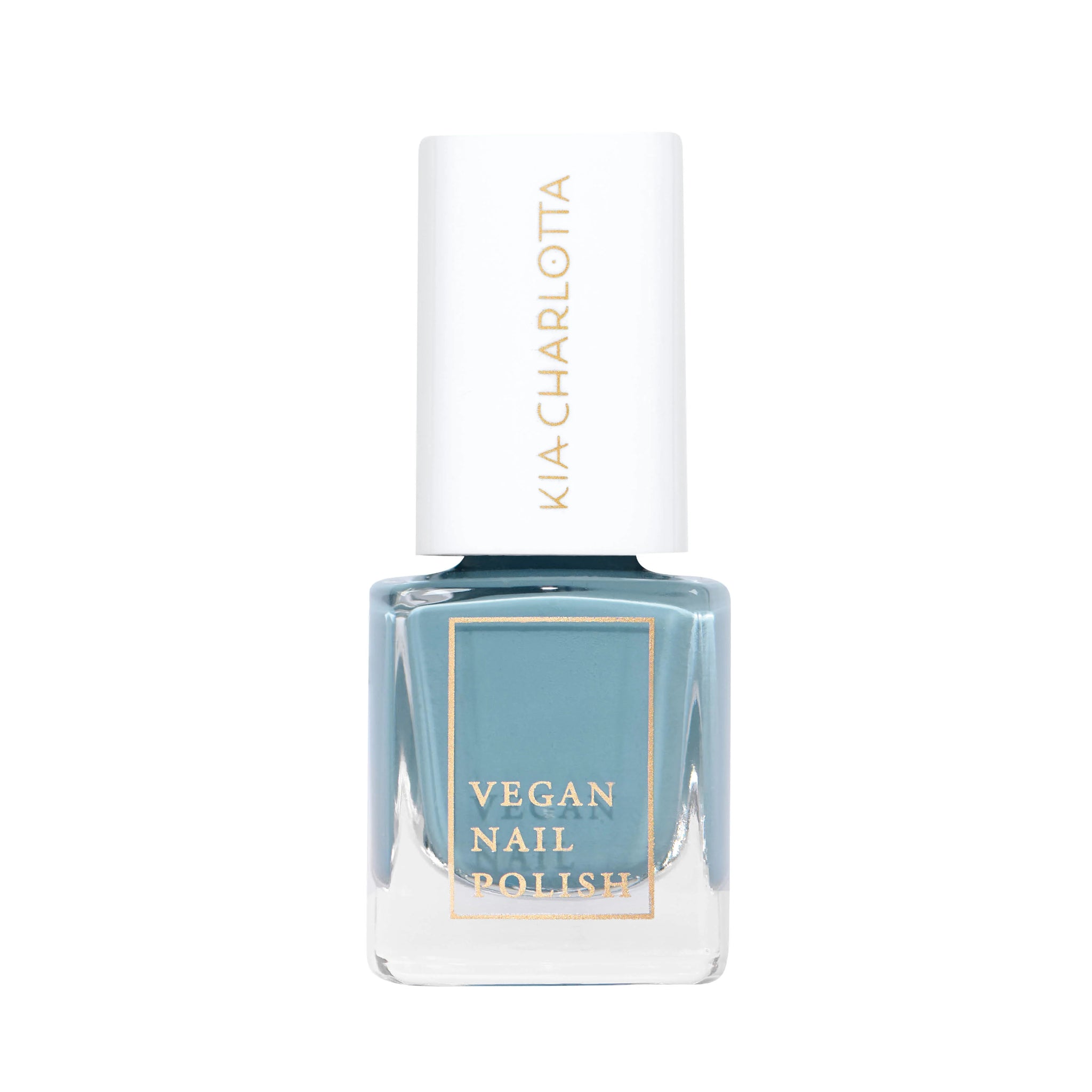 Flasche veganer Nagellack in einem blauen Farbton mit weißem Deckel und goldener Schrift.