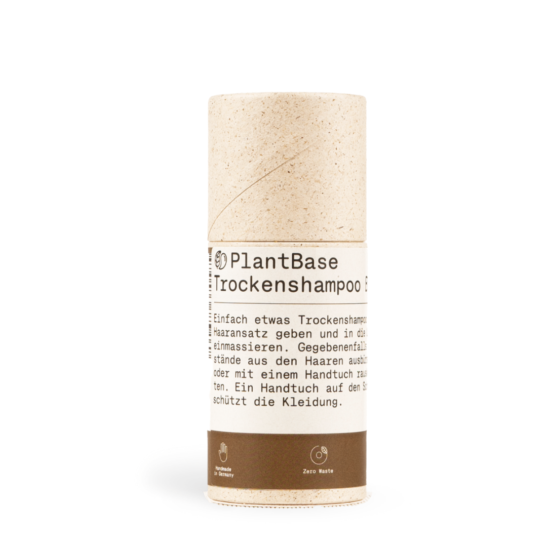 Zylinderförmige Verpackung von PlantBase Trockenshampoo mit minimalistischem Design und Zero Waste-Logo.