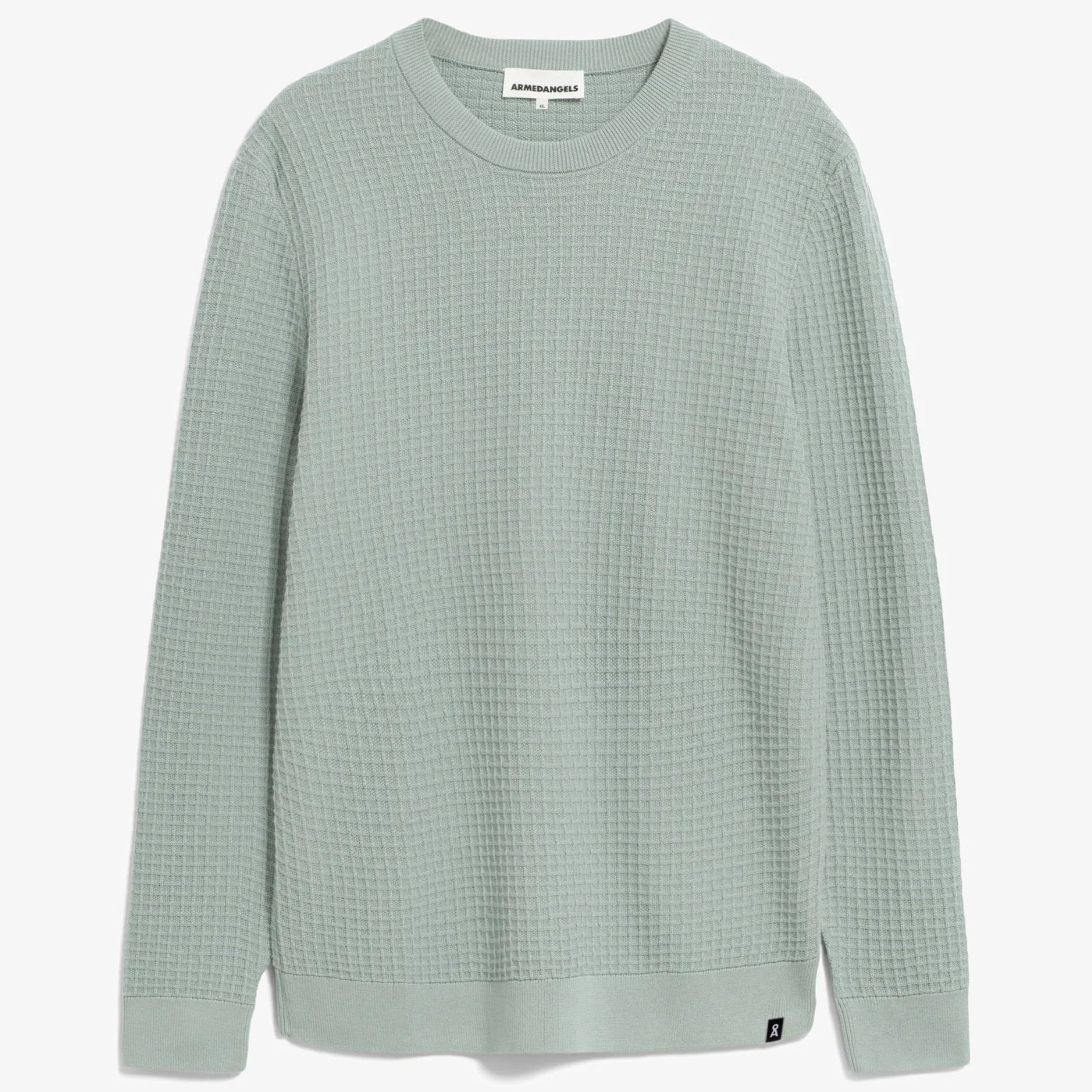 Ein hellgrüner, langärmeliger Pullover aus Waffelstrick mit Rundhalsausschnitt, flach auf weißem Hintergrund dargestellt.