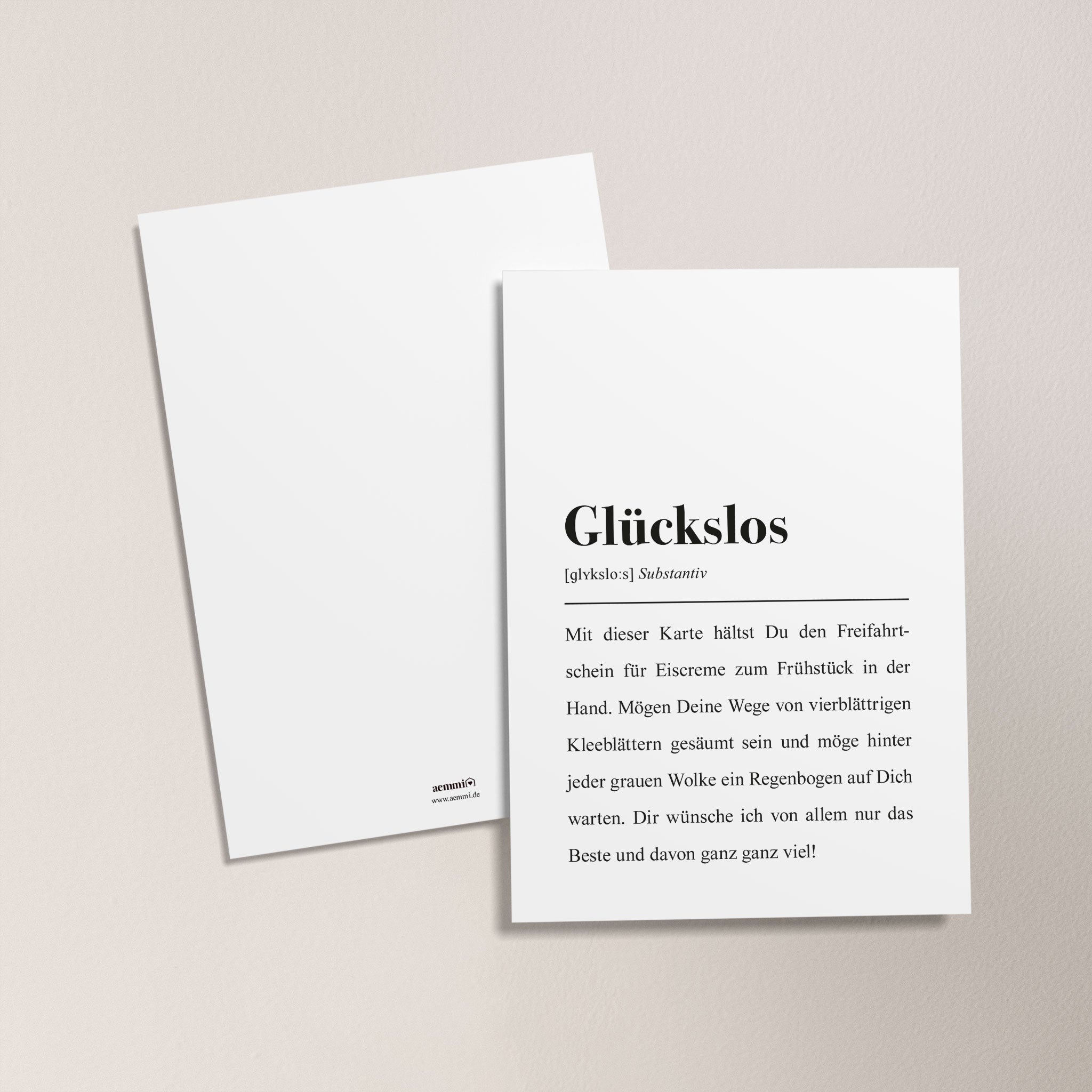Zwei Karten auf hellem Hintergrund, eine mit dem Wort "Glückslos" und einem erklärenden Text bedruckt.