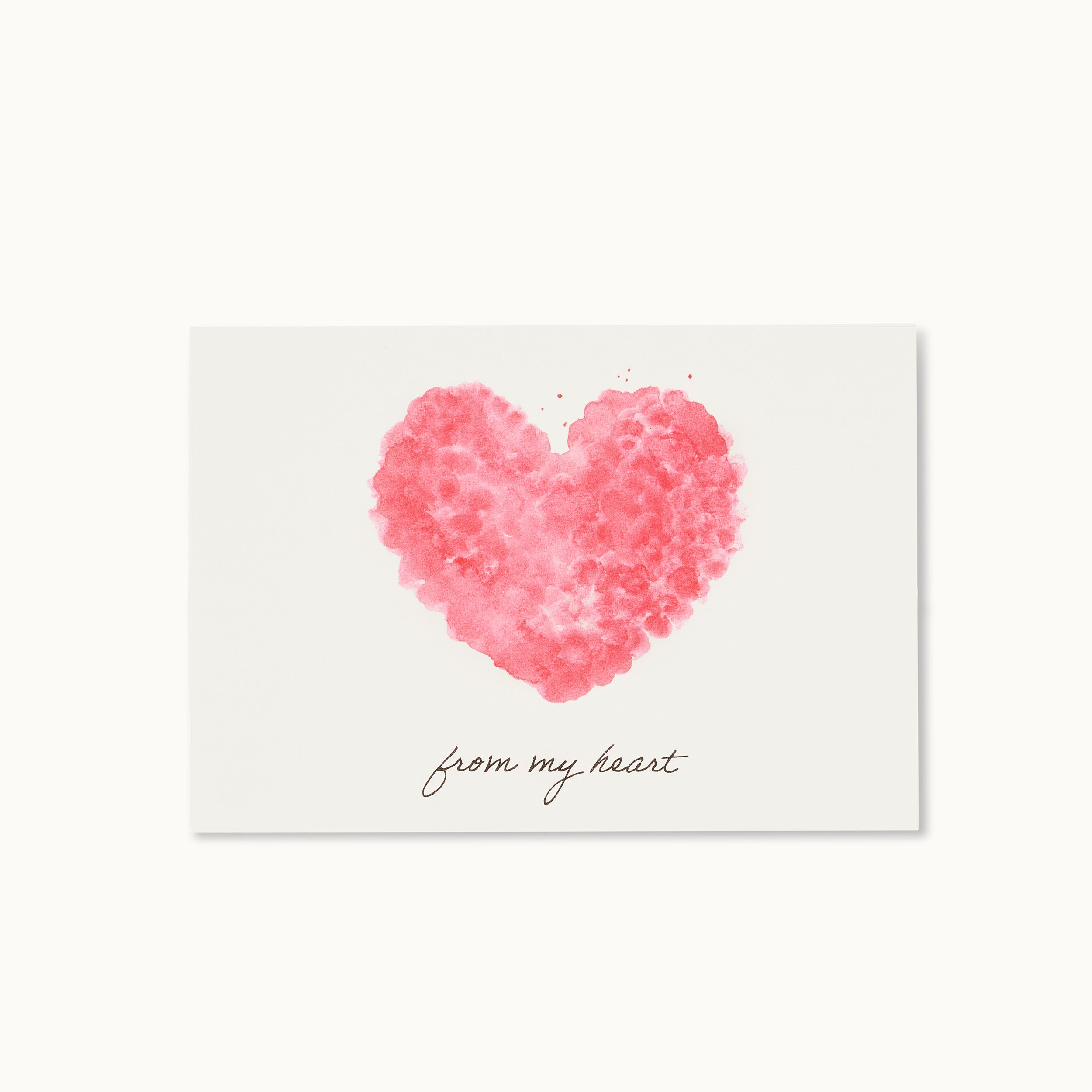 Eine rosa Aquarellkarte mit einem Herzmotiv und dem handgeschriebenen Text "from my heart" darunter.