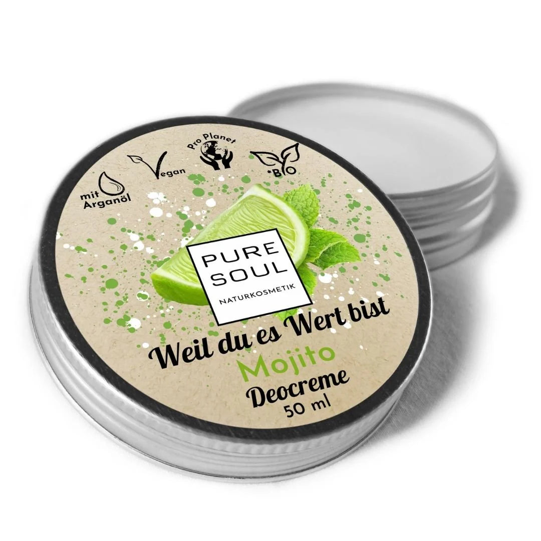Eine runde Dose Pure Soul Naturkosmetik Mojito Deocreme, 50 ml, mit einer grünen Limetten- und Minzgrafik auf dem Deckel. Auf der Verpackung sind Symbole für Veganismus, Umweltfreundlichkeit und Arganöl abgebildet.