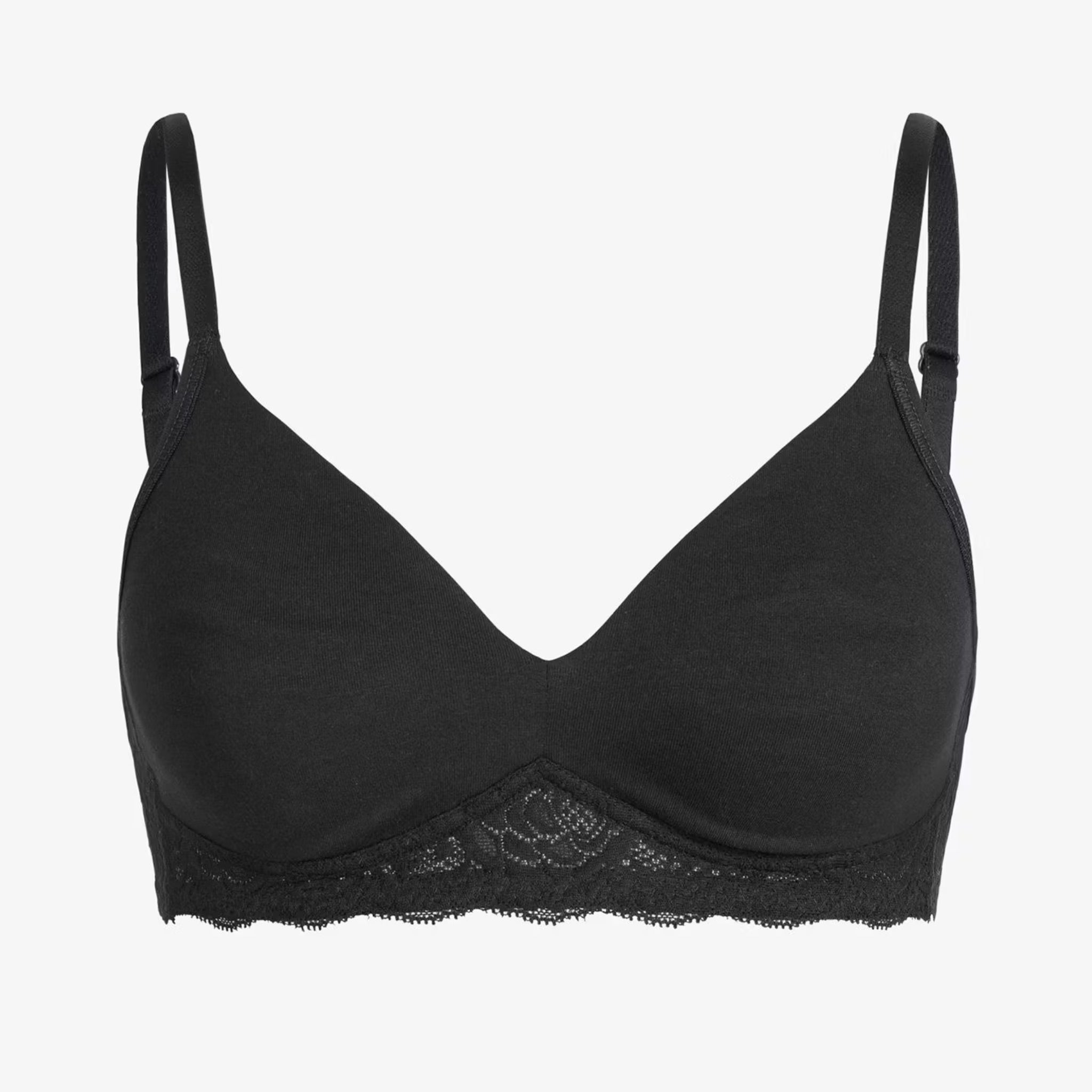 Schwarzer BH mit dünnen Trägern und Spitzenbesatz am unteren Rand, auf weißem Hintergrund.