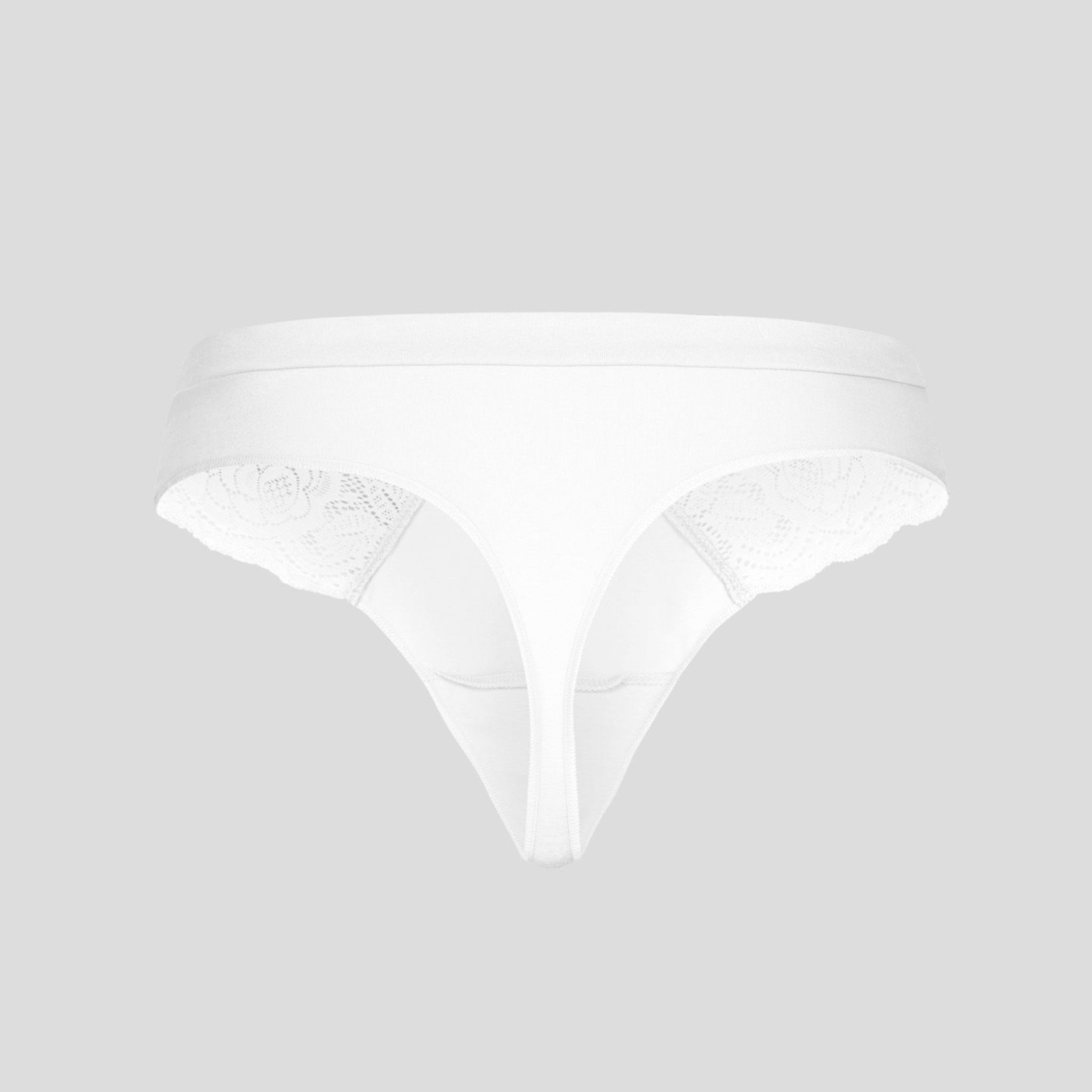 Ein weißer Damen-Tanga aus Spitze auf grauem Hintergrund.