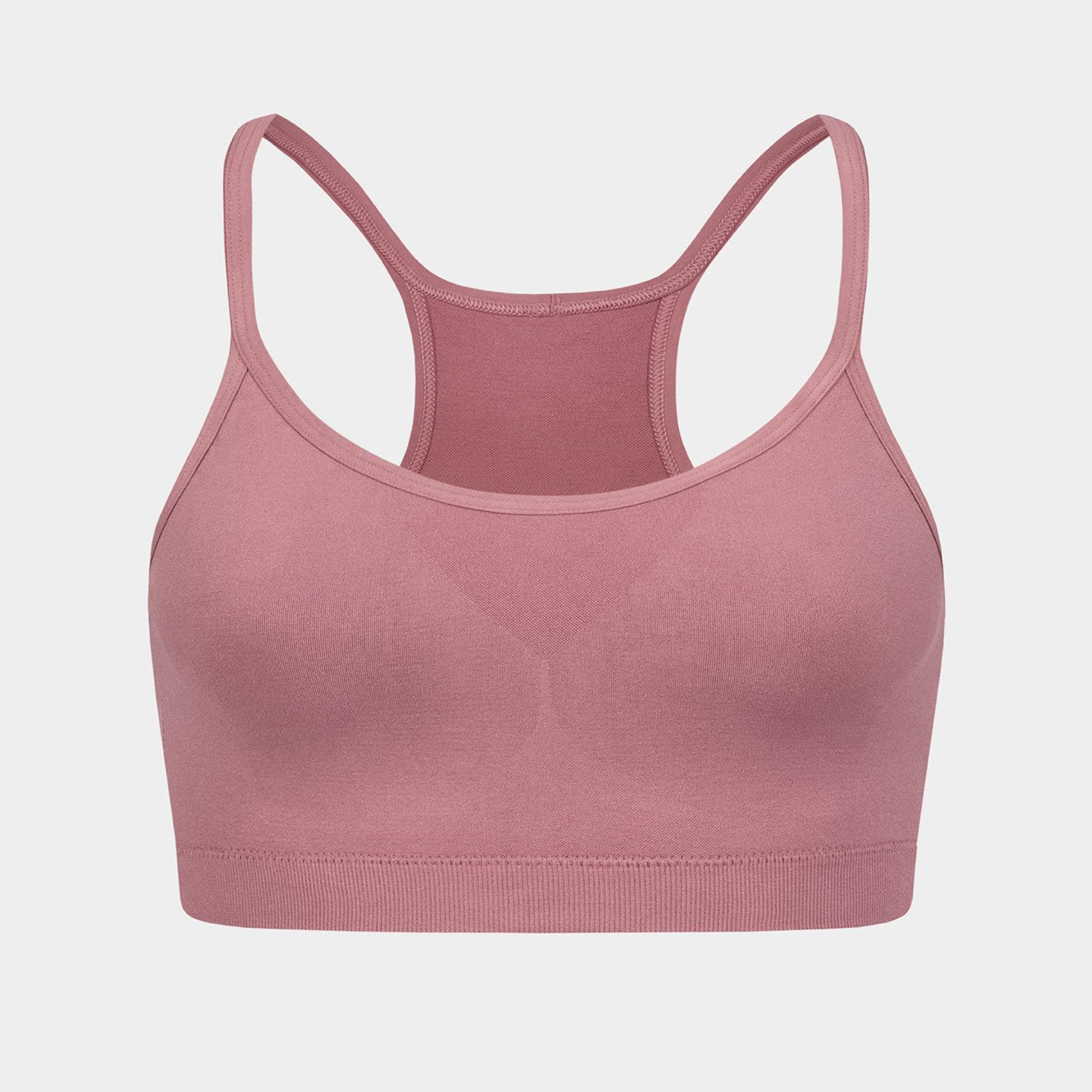 Rosa Sport-BH mit dünnen Trägern und einem Racerback-Design auf weißem Hintergrund.