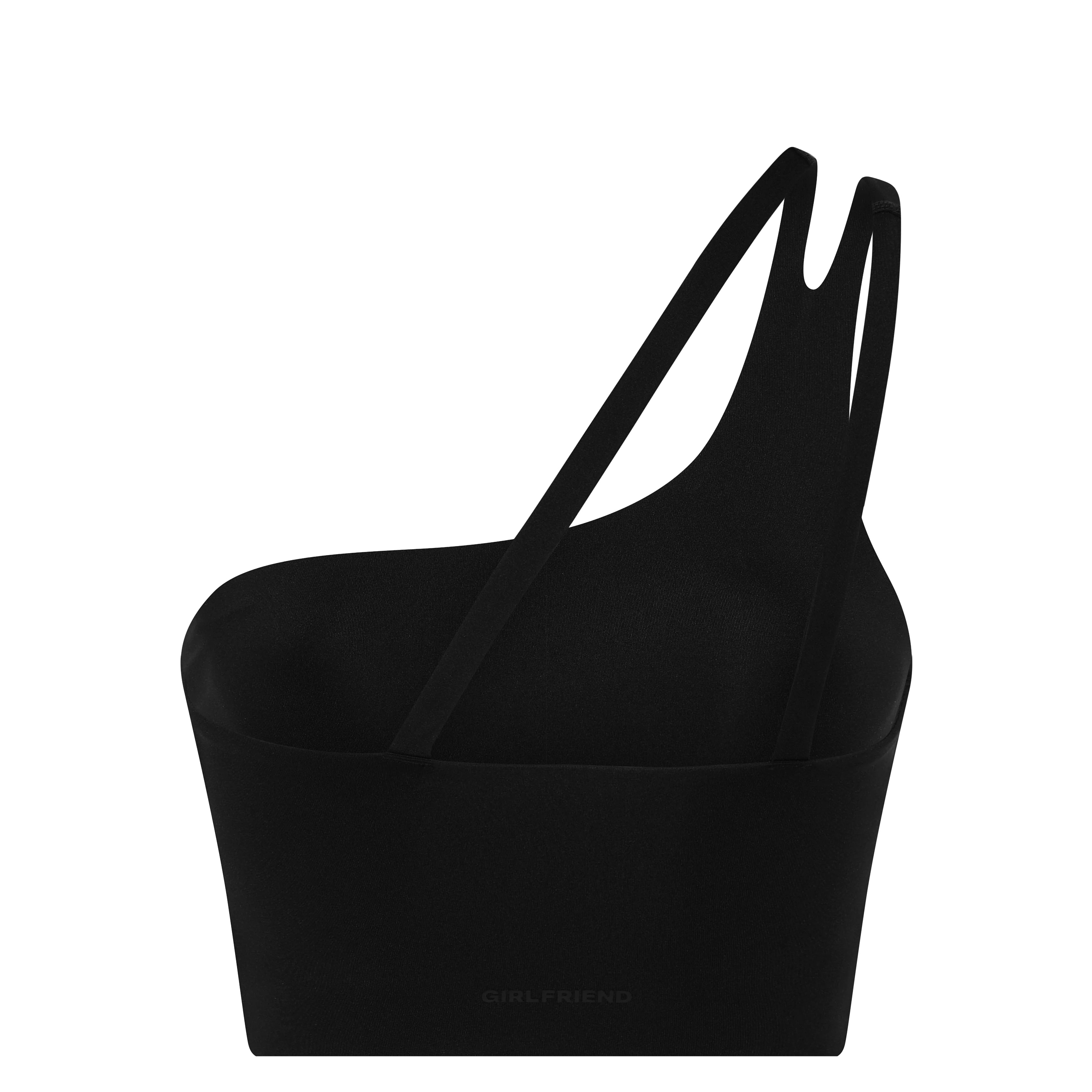 Minimalistische schwarze Schultertasche mit asymmetrischem, skulpturalem Design und zwei dünnen Trägern. Die Tasche hat eine glatte Textur und ein dezent geprägtes GIRLFRIEND-Logo im unteren Bereich.