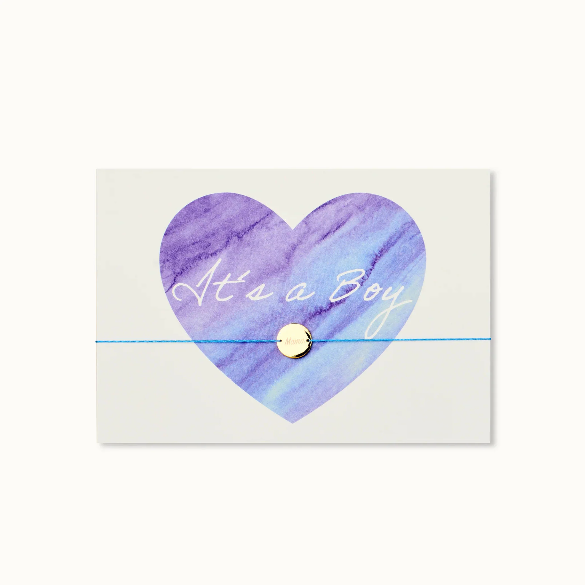 Karte mit lila Herz und Schriftzug "It's a Boy", darunter eine blaue Schnur mit goldenem Knopf.