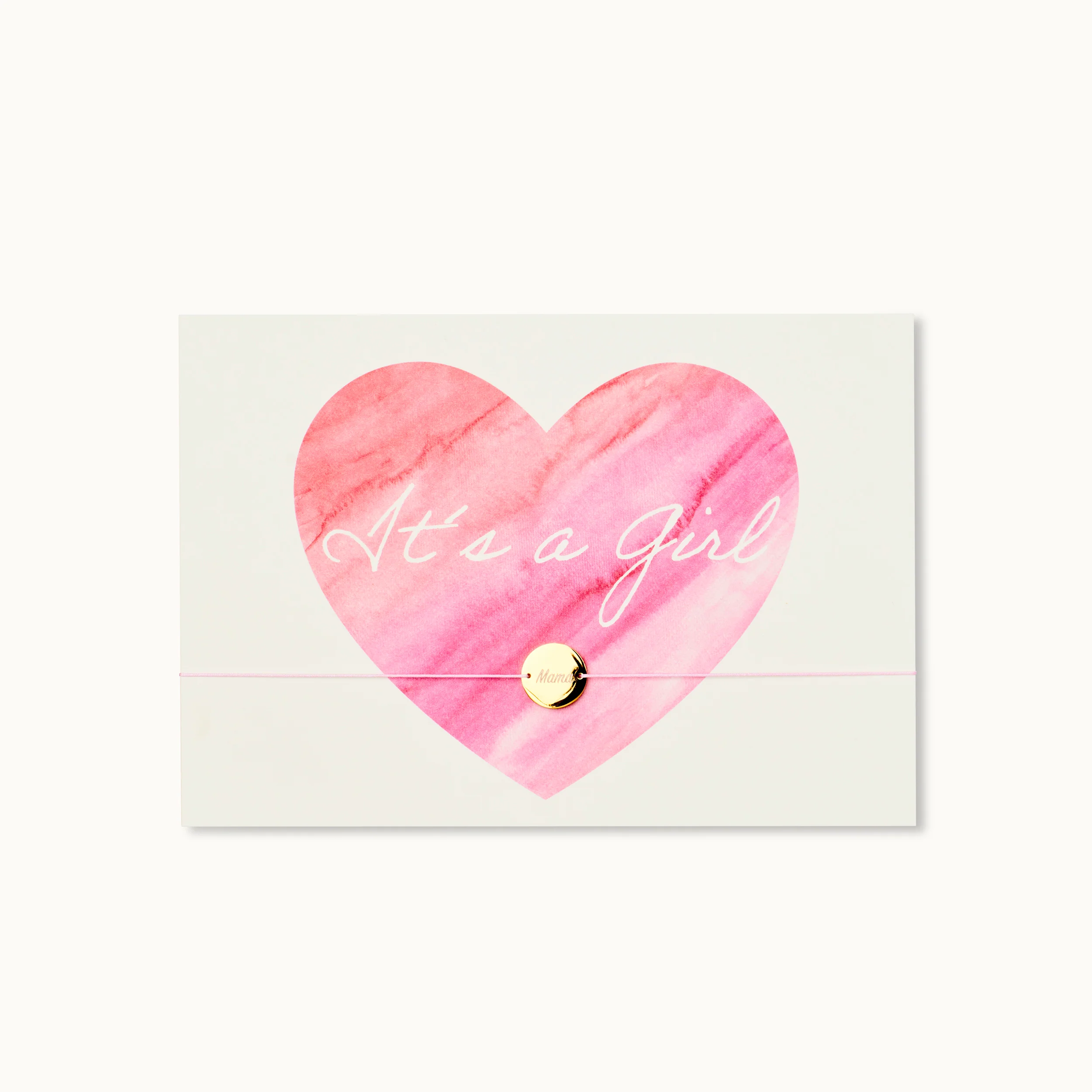 Weiße Karte mit rosa Herz und goldenem Anhänger; Aufschrift: "It's a girl".