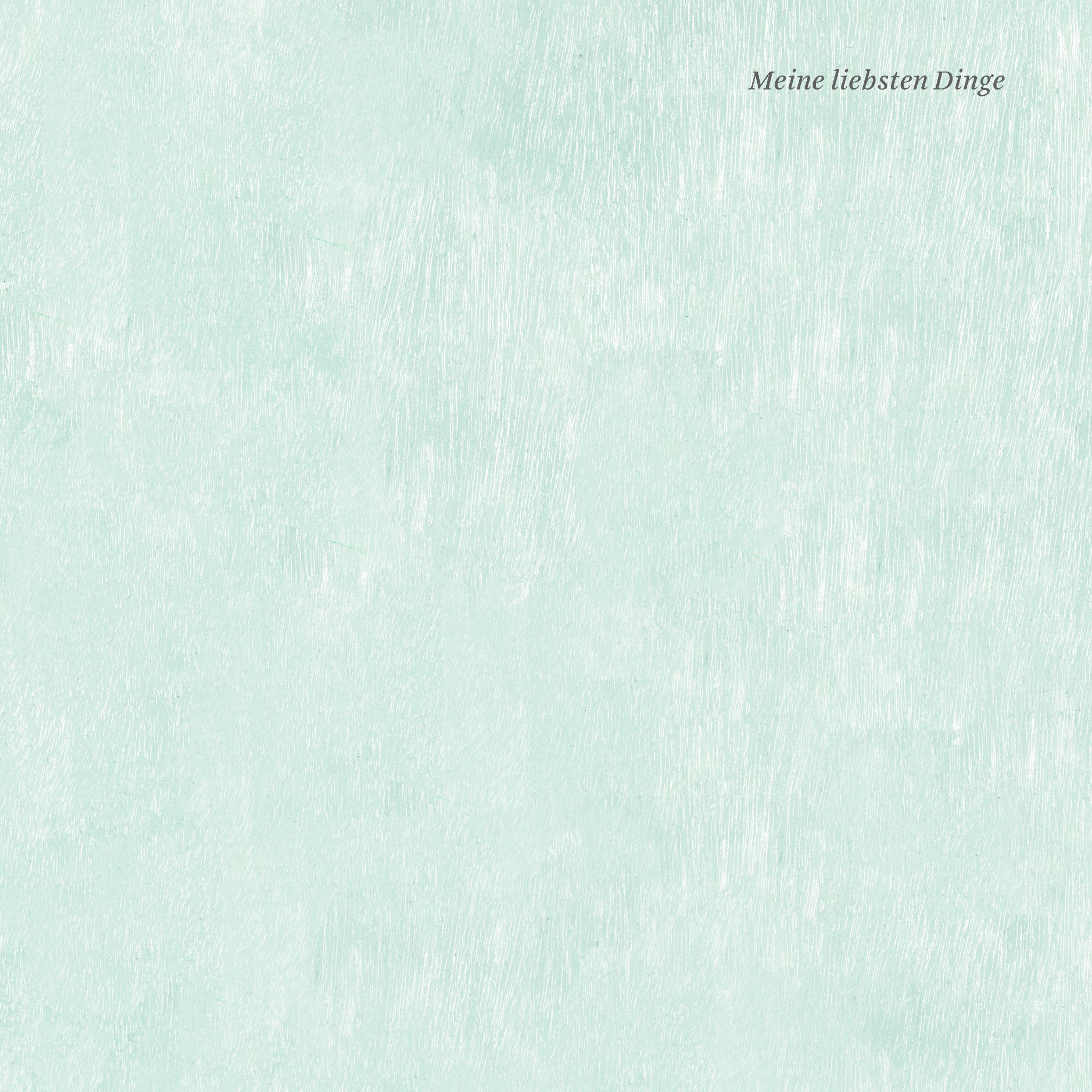 Ein leicht pastellgrüner, strukturierter Hintergrund mit dem deutschen Satz Meine liebsten Dinge in kleiner, kursiver Schrift in der oberen rechten Ecke.