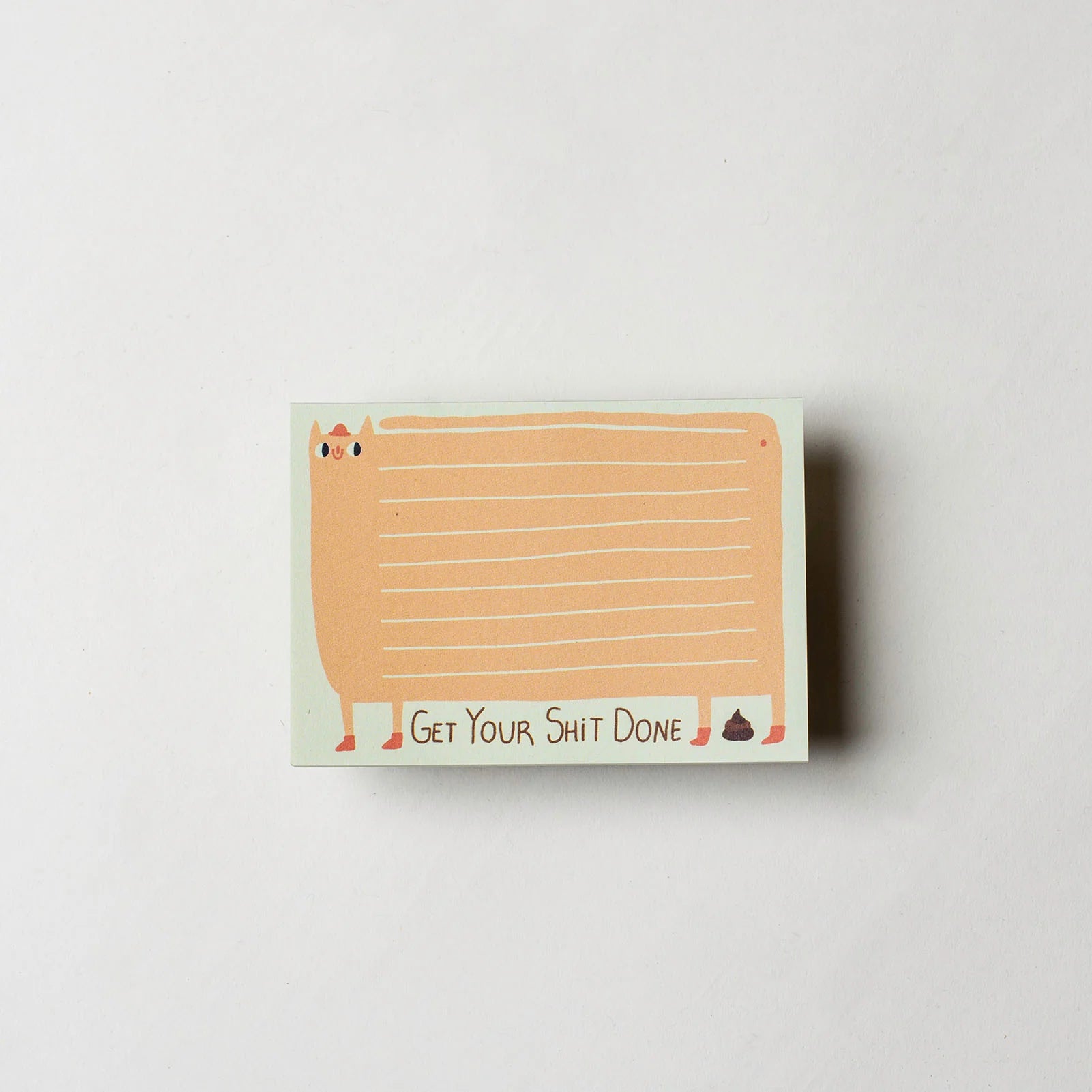 Notizblock mit Katzenmotiv, der Text "Get Your Shit Done" und eine kleine Haufenzeichnung.