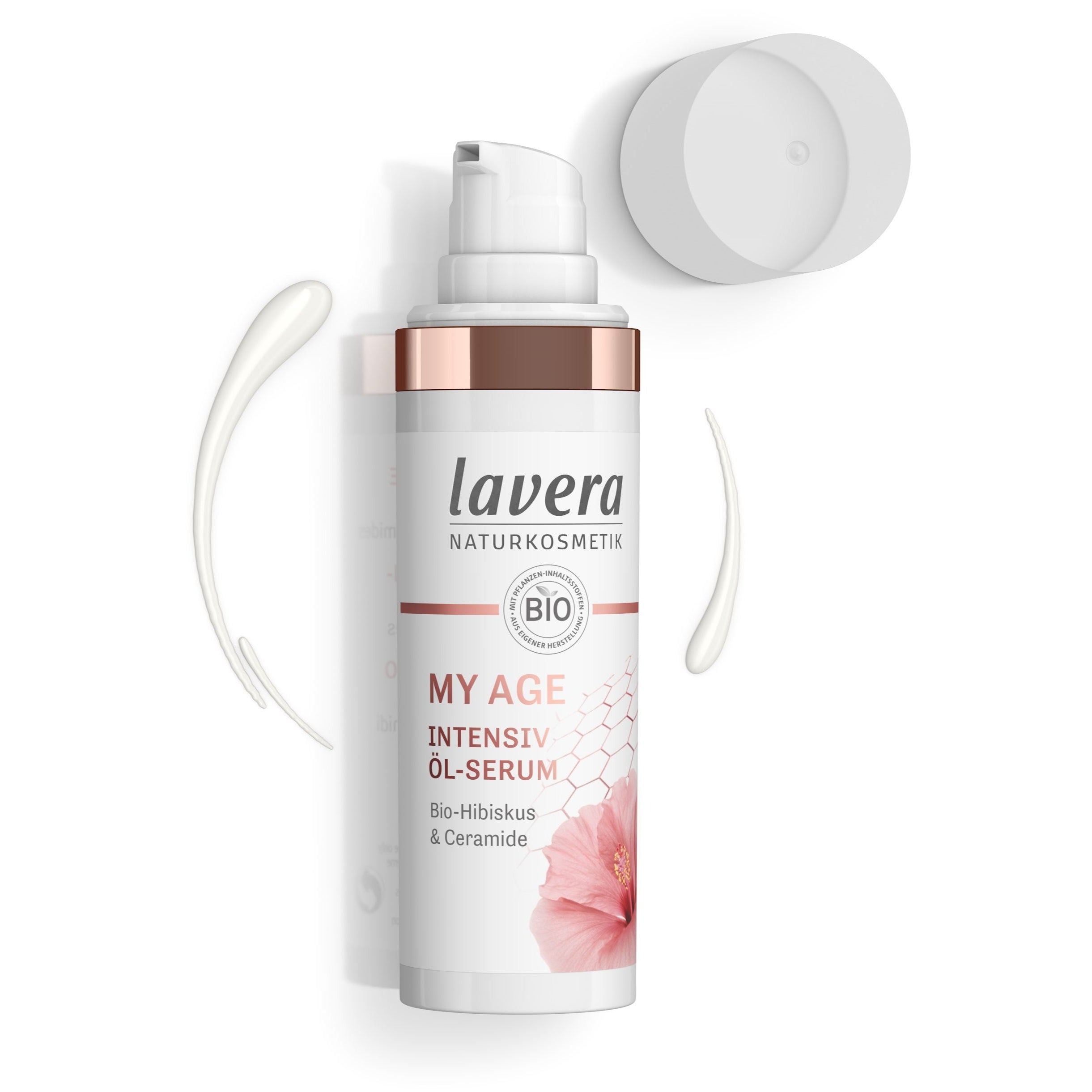 Flasche Lavera My Age Intensiv Öl-Serum mit roségoldenem Verschluss, daneben weiße Creme und abgenommener Deckel.