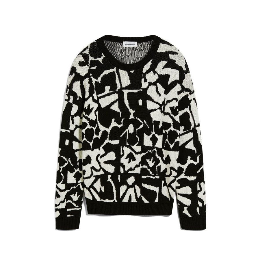 Schwarz-weißer Pullover mit abstraktem Muster auf weißem Hintergrund.