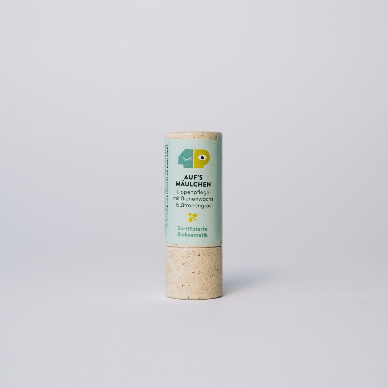 Bio-Lippenpflege in einem umweltfreundlichen, zylindrischen Behälter mit Etikett "Auf's Mäulchen" und grünem Design.