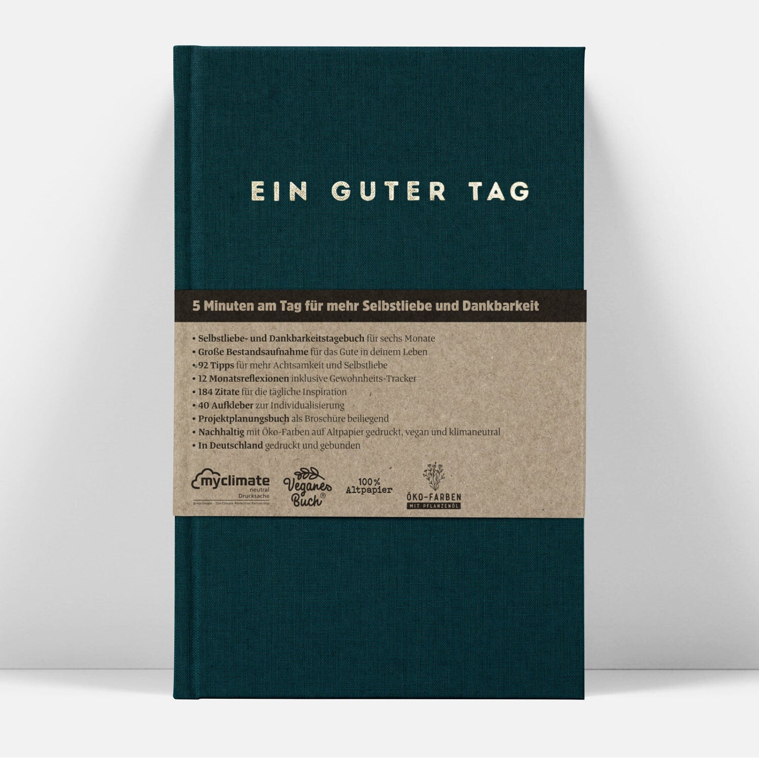 Grünes Buch mit dem Titel "EIN GUTER TAG", enthält Tipps für Selbstliebe und Dankbarkeit, nachhaltig produziert.