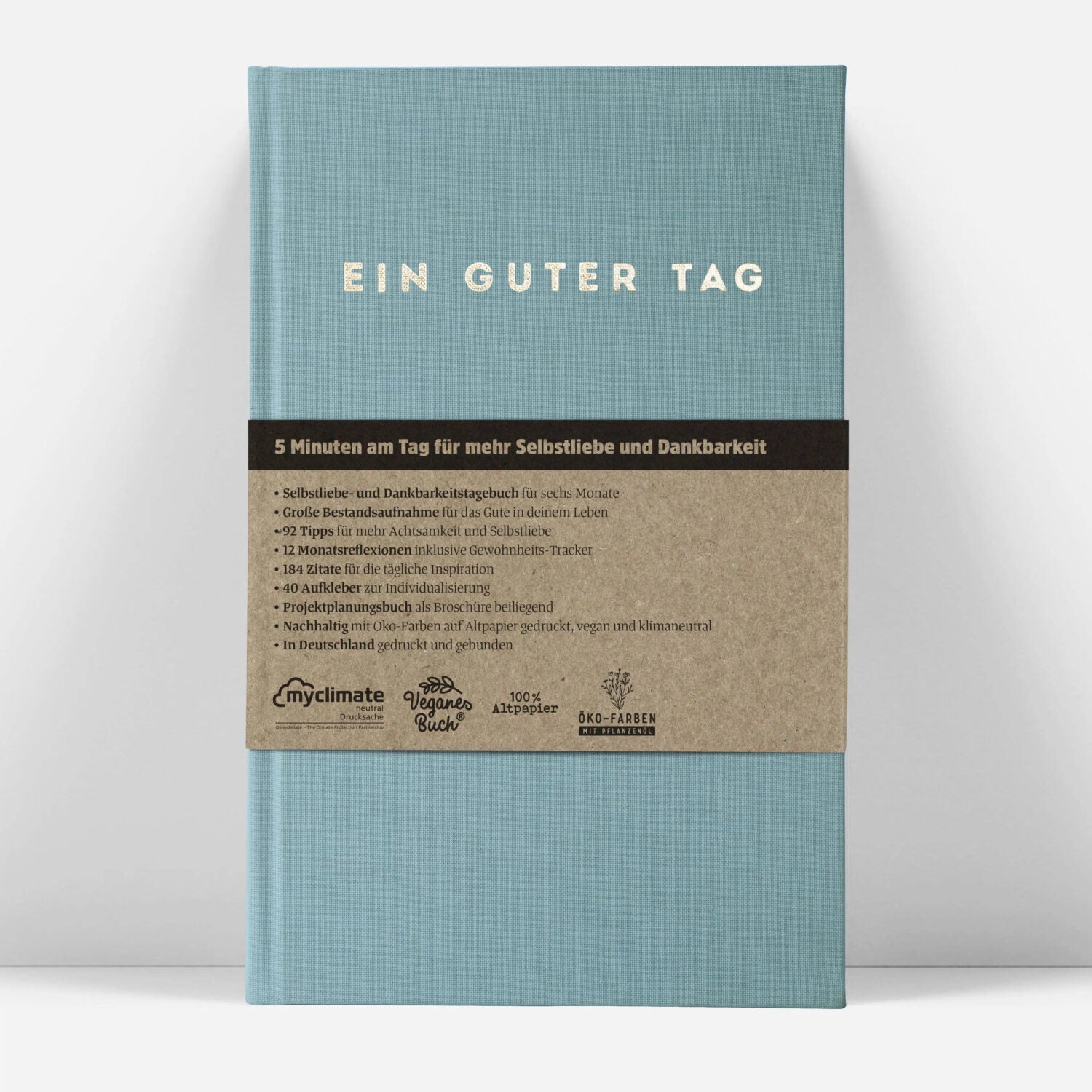 Notizbuch mit dem Titel "Ein guter Tag" und beschreibt ein Tagebuch für Selbstliebe und Dankbarkeit mit umweltfreundlichen Materialien.