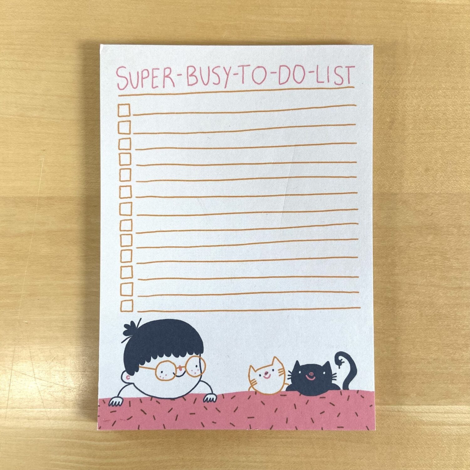 Notizblock mit der Überschrift "Super-Busy-To-Do-List", einer Cartoon-Person und zwei Katzen am unteren Rand.