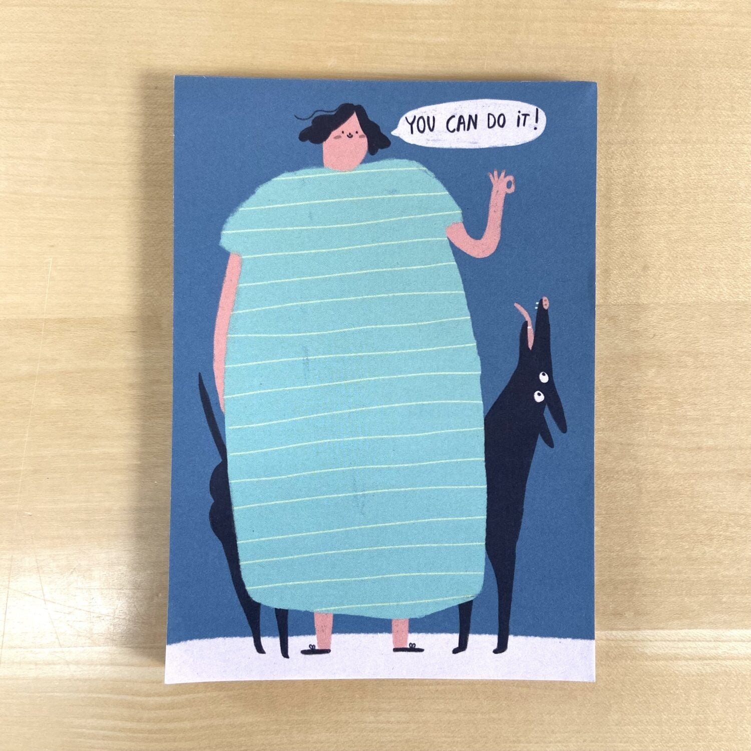 Illustration einer Person in einem gestreiften Kleid mit zwei Hunden; Sprechblase sagt: "You can do it!"