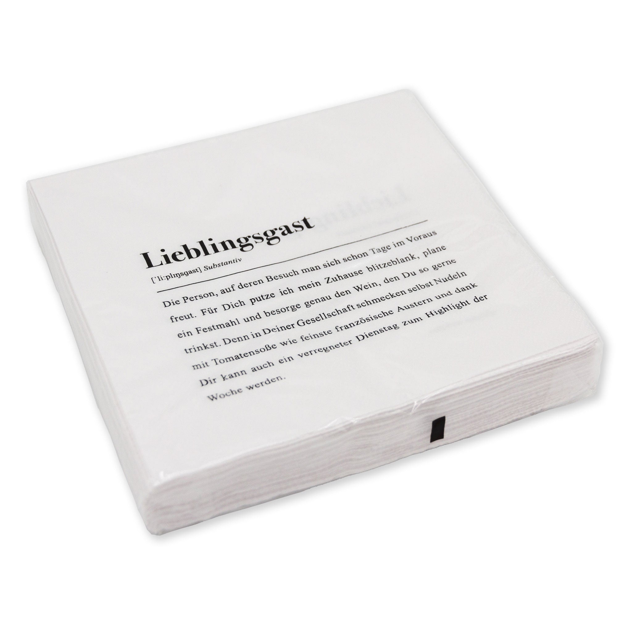 Ein Stapel weißer Servietten mit dem Aufdruck "Lieblingsgast" und einem erklärenden Text darunter.
