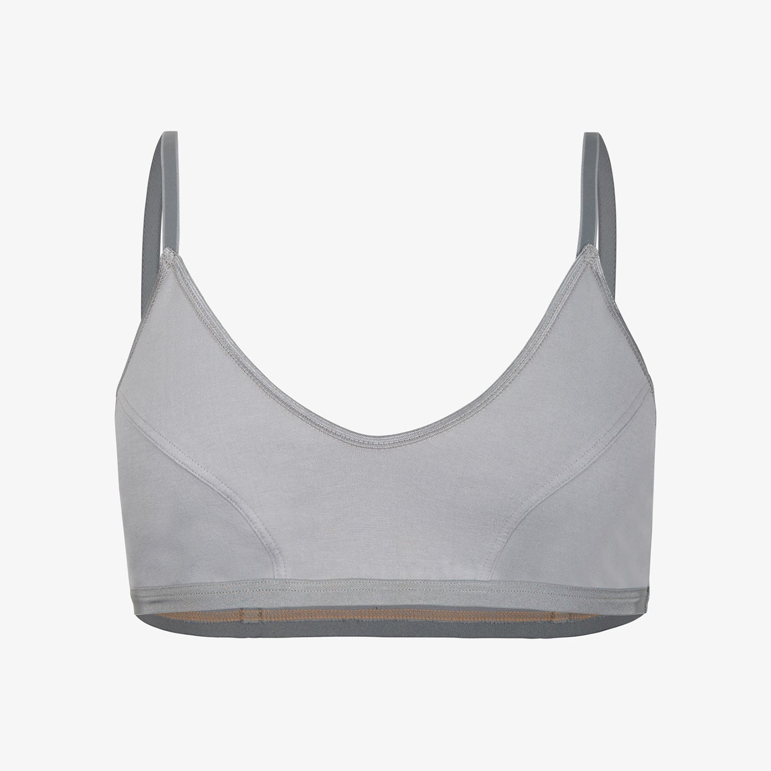 Graues, ärmelloses Sport-BH mit dünnen Trägern und schlichtem Design vor weißem Hintergrund.