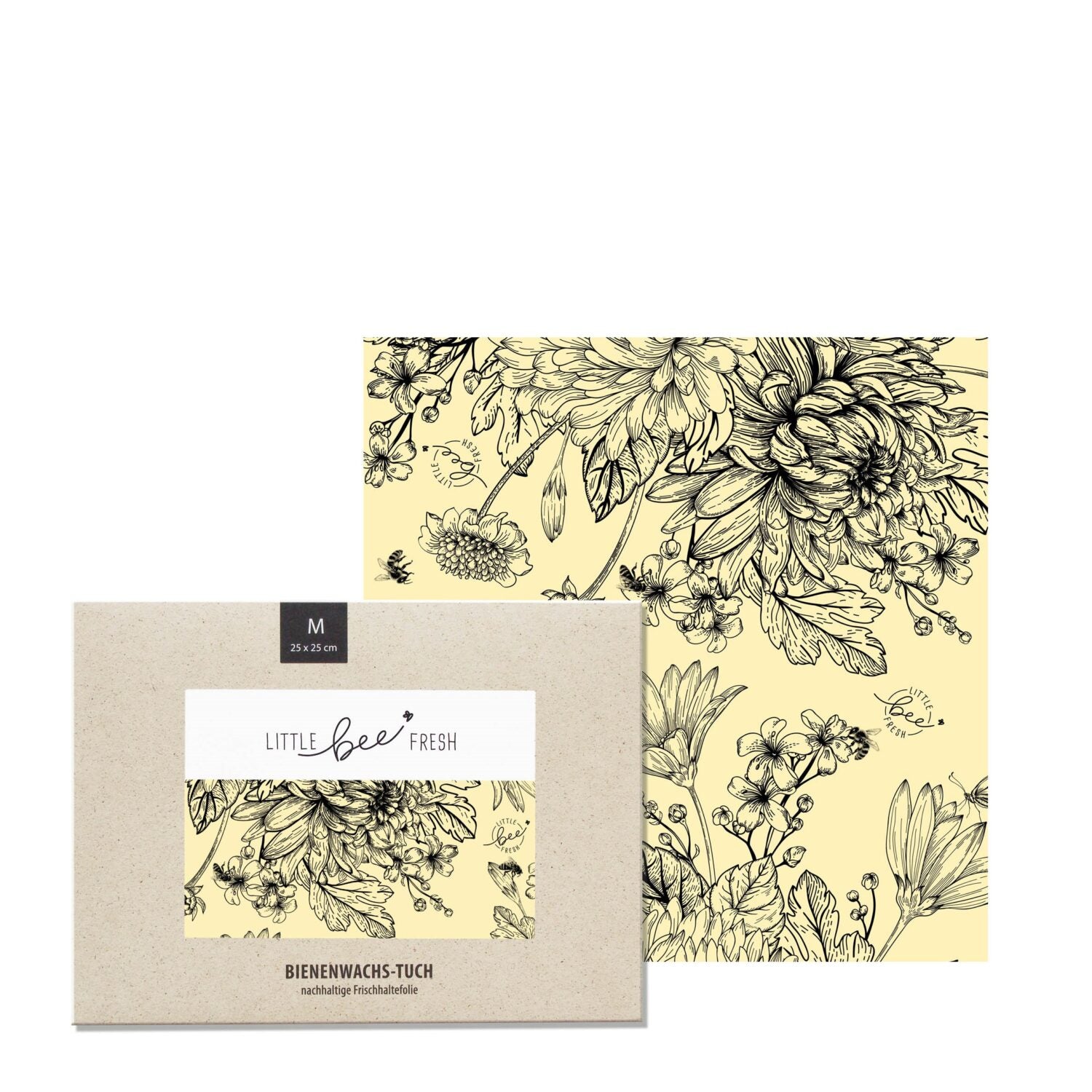 Bienenwachstuch mit floralem Muster in Schwarz-Weiß auf gelbem Hintergrund, verpackt in einer Kartonhülle.