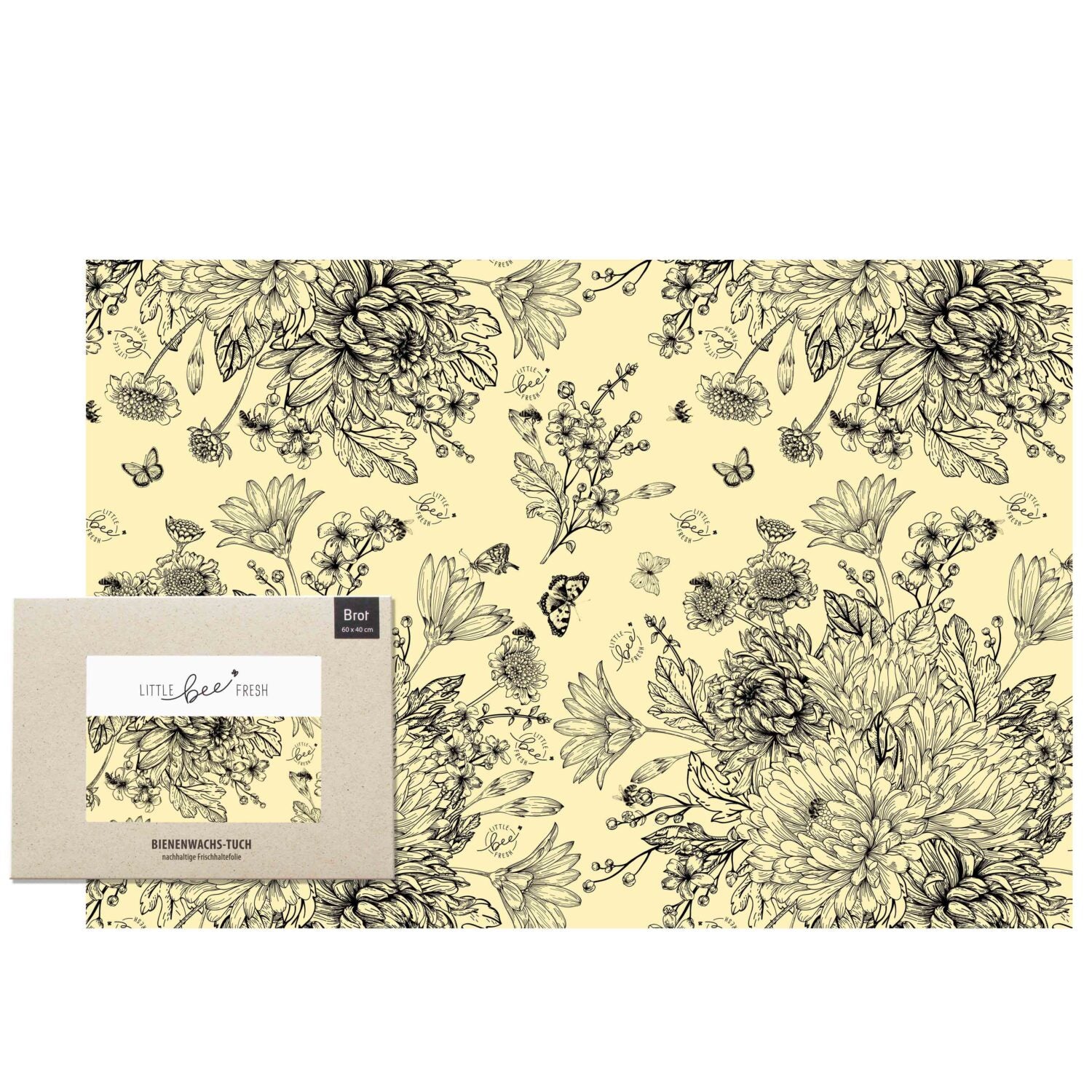 Gelbes Bienenwachstuch mit floralen und schmetterlingsartigen Mustern im Vintage-Stil, verpackt in einer Kartonhülle.