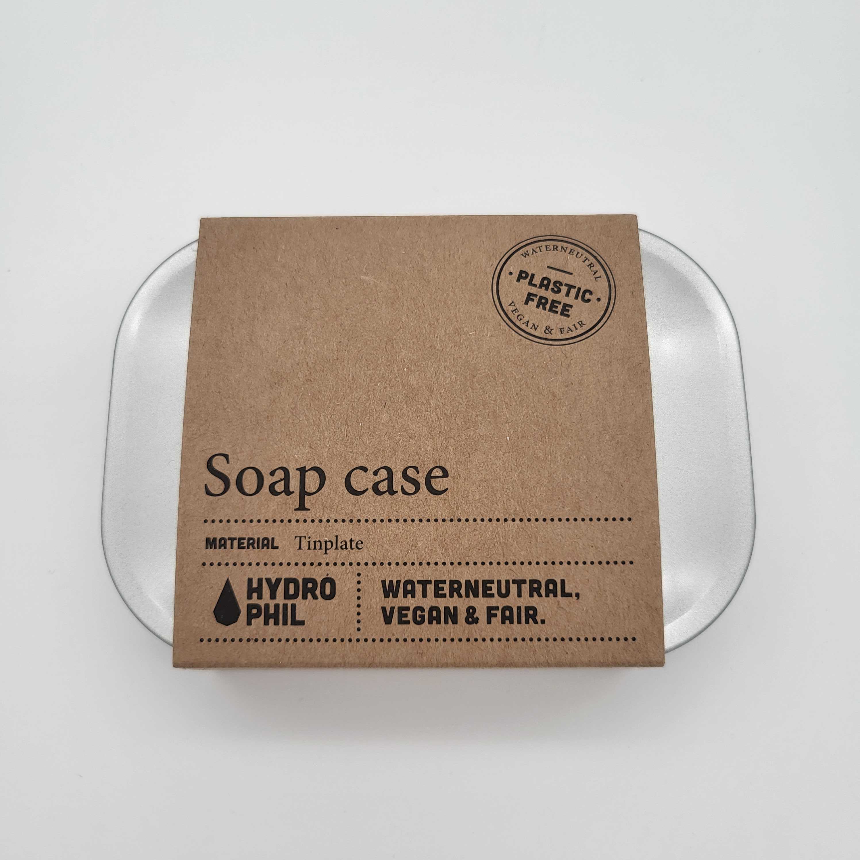 Metallene Seifenschale mit brauner Pappverpackung, die „Soap case“ und „PLASTIC FREE“ trägt.