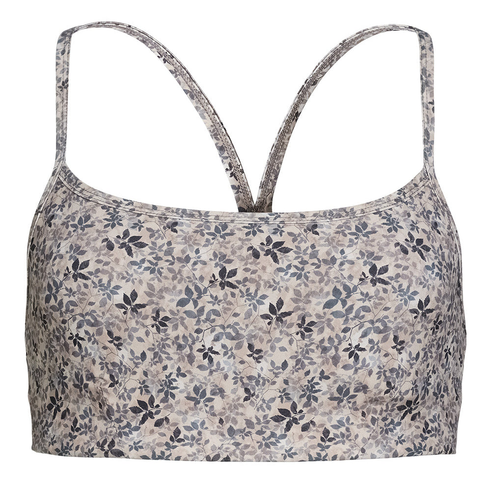 Ein tailliertes Tank-Top mit dünnen Trägern, das ein dezentes Blumenmuster in Grau-, Beige- und Schwarztönen aufweist. Der Hintergrund ist einfarbig weiß.