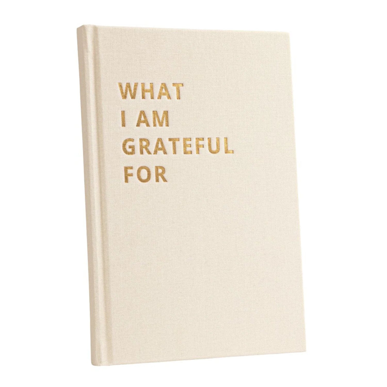 Eine beigefarbene Zeitschrift mit festem Einband und goldgeprägtem Text auf der Vorderseite: Wofür ich dankbar bin, fotografiert vor einem weißen Hintergrund.