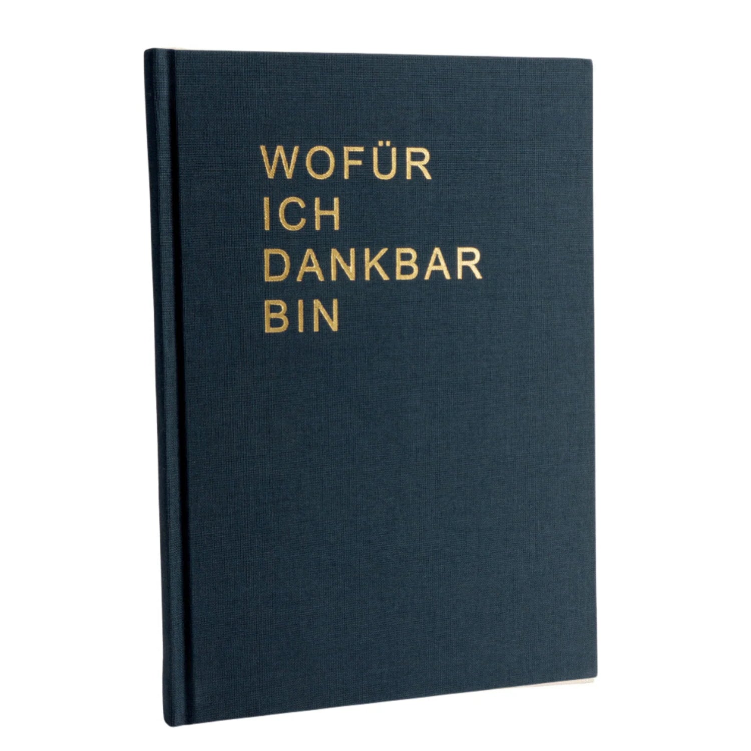Ein dunkelblaues Hardcover-Buch mit goldgeprägtem deutschen Text auf dem Einband: WOFÜR ICH DANKBAR BIN. Das Buch steht aufrecht vor einem weißen Hintergrund.